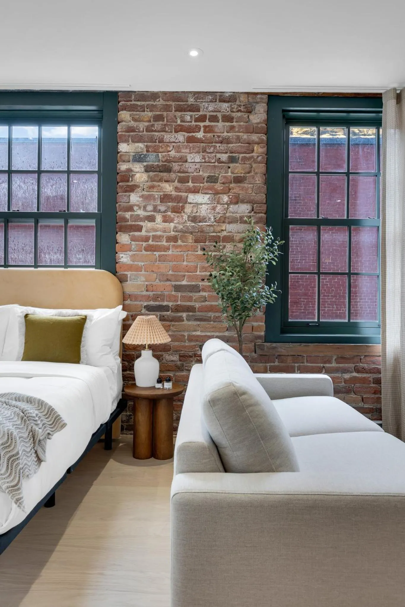 Bed in The Mercer Boutique Hotel