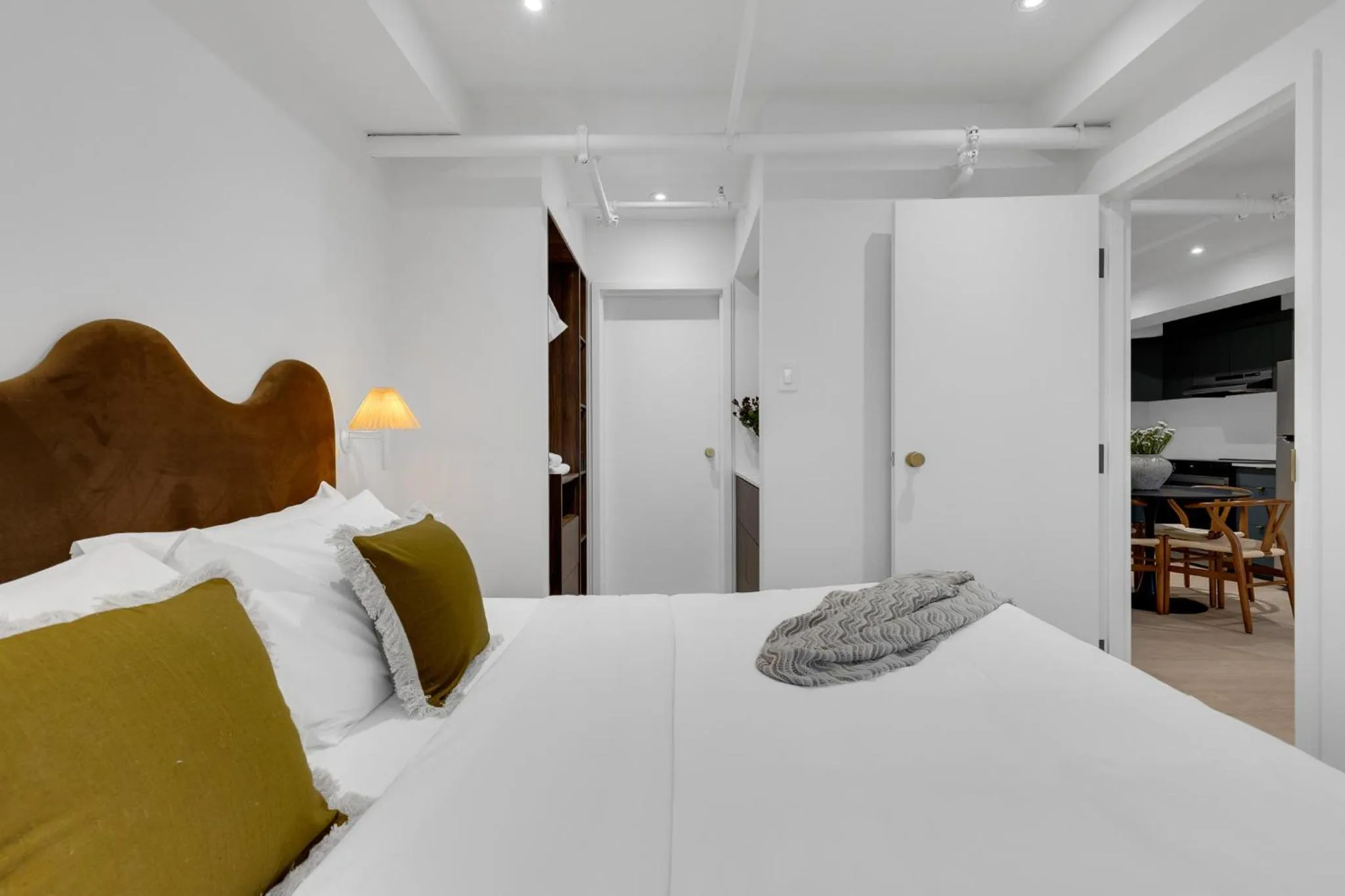 Bed in The Mercer Boutique Hotel