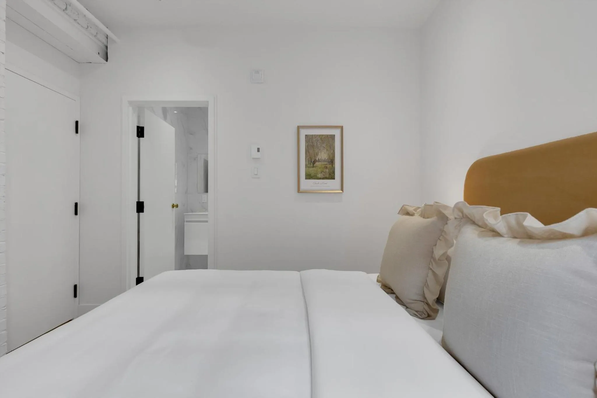 Bed in The Mercer Boutique Hotel