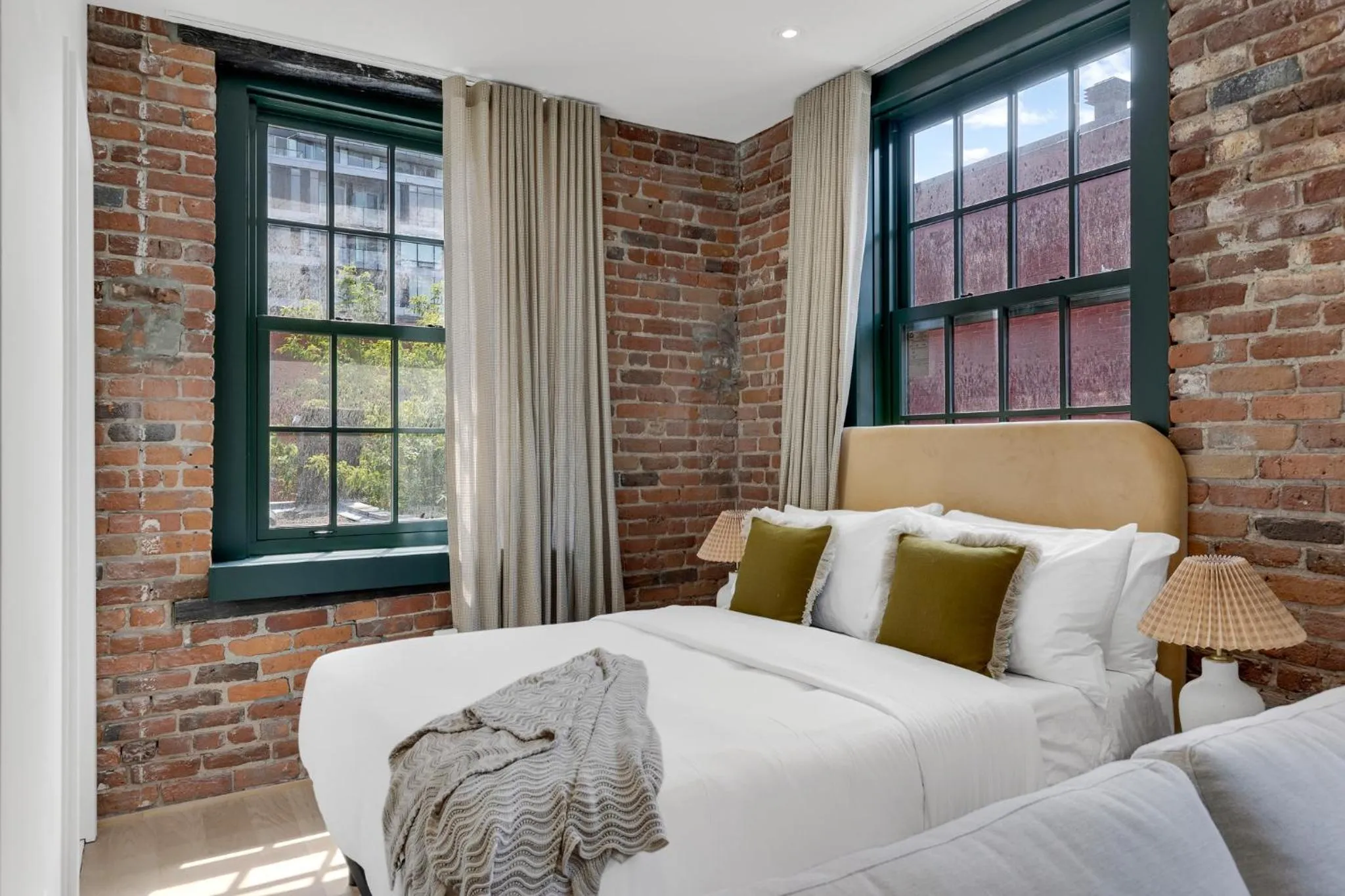 Bed in The Mercer Boutique Hotel