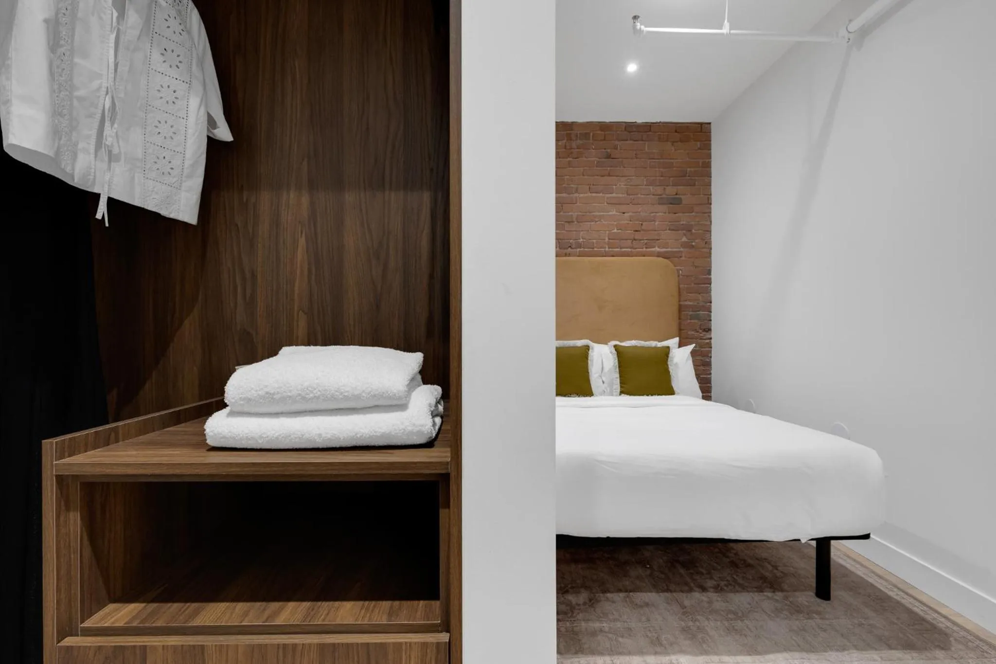 Bed in The Mercer Boutique Hotel