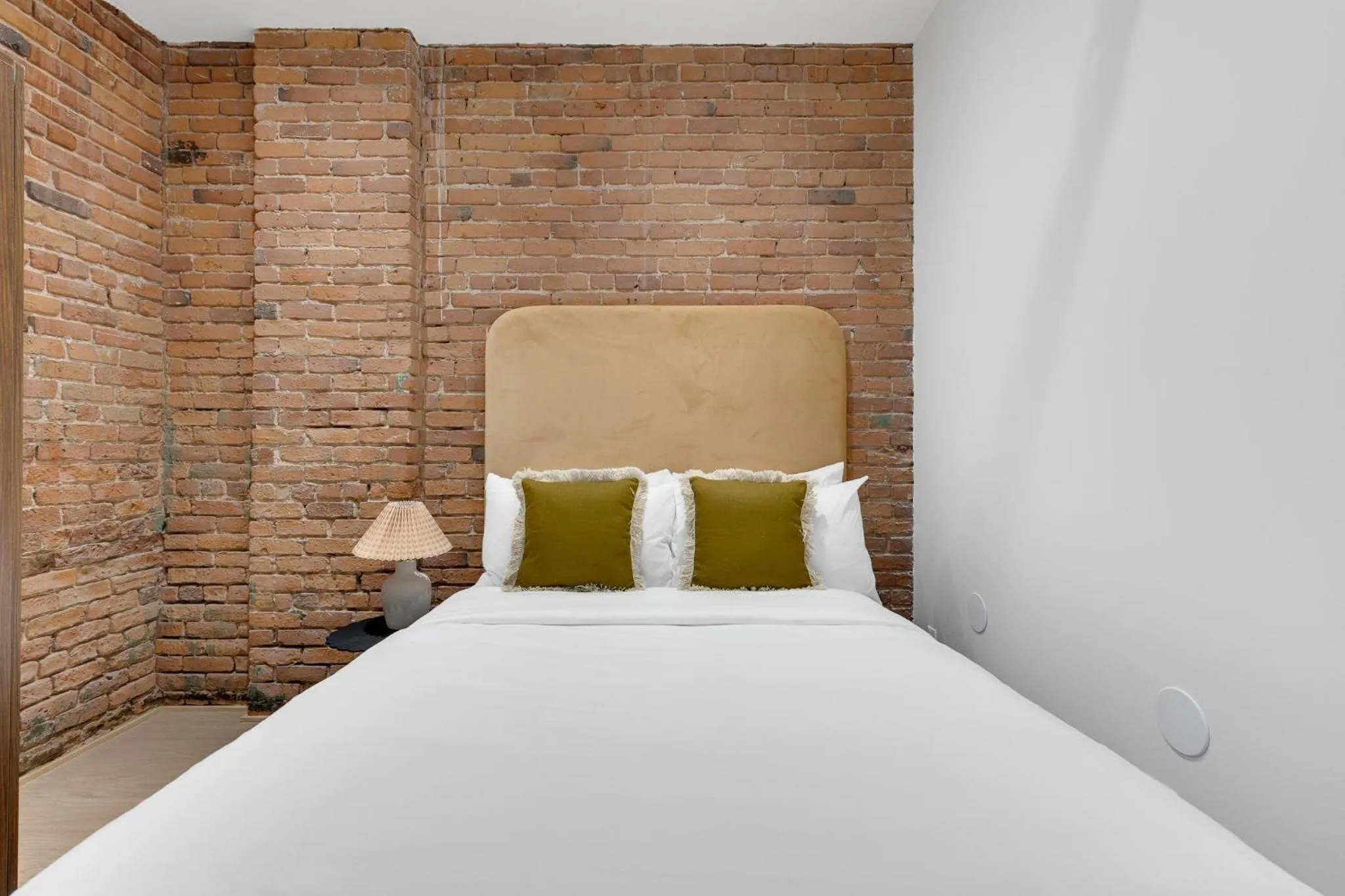 Bed in The Mercer Boutique Hotel