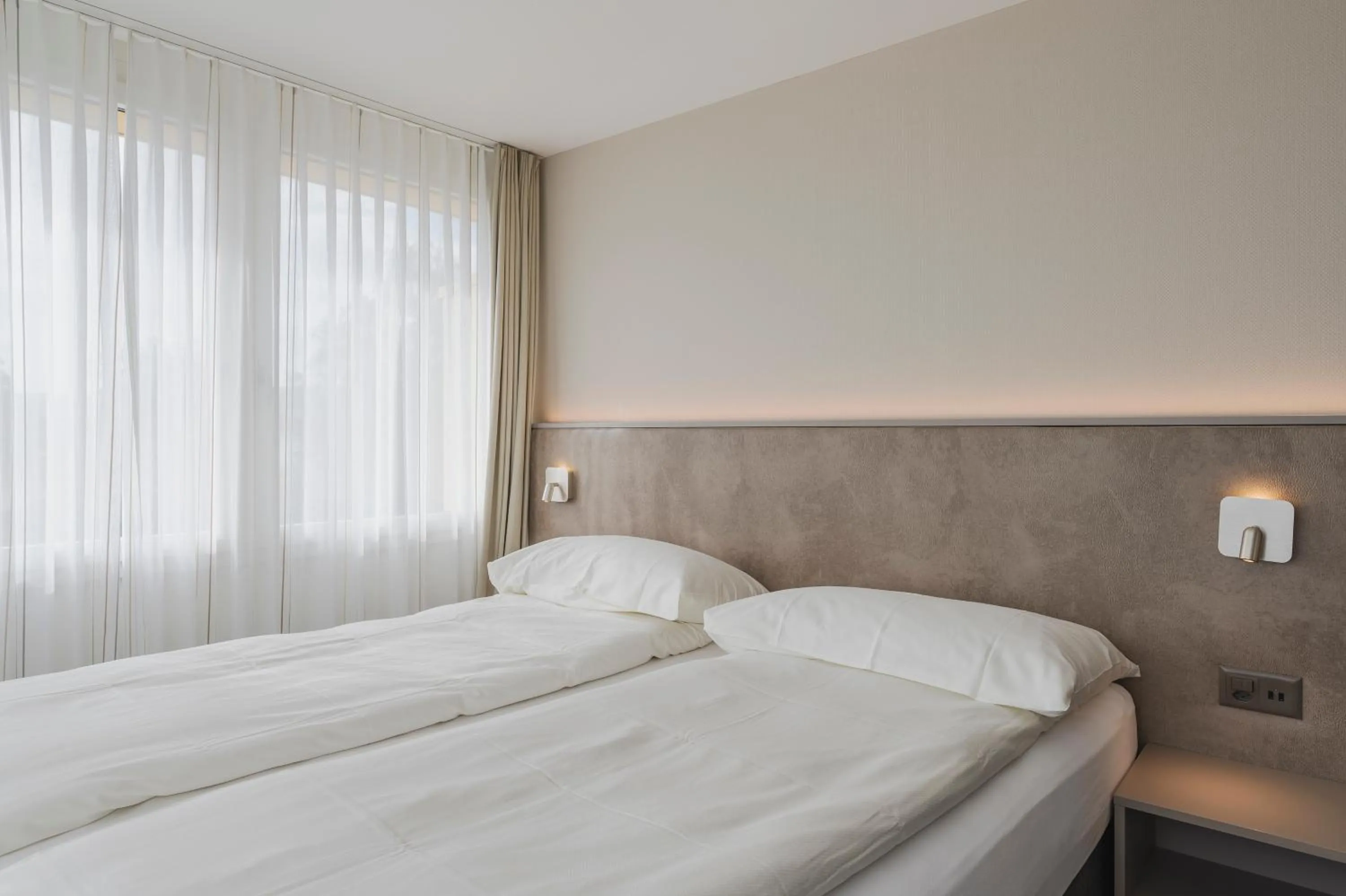 Bed in Amanthos Living Zürich Airport