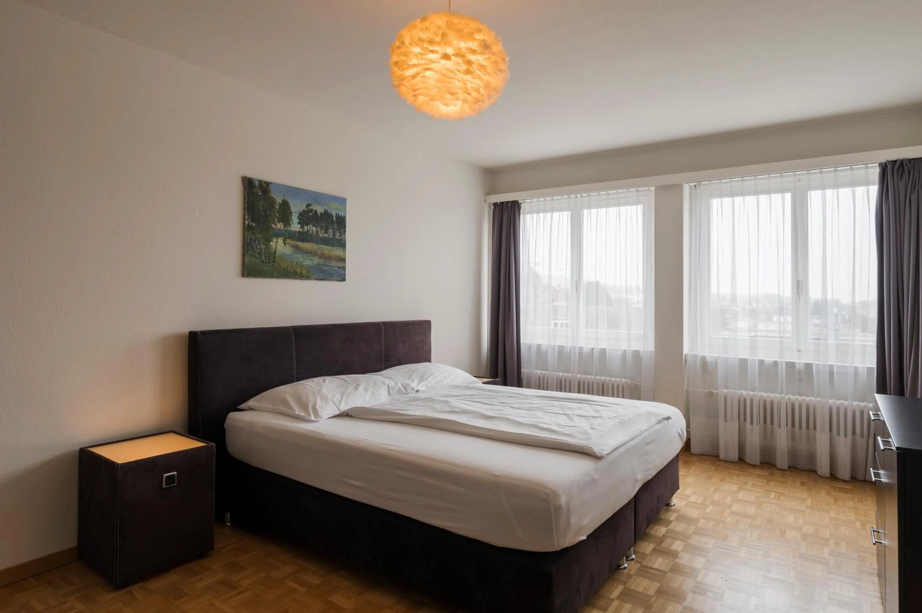 Photo of the whole room, Bed in Amanthos Living Solothurn