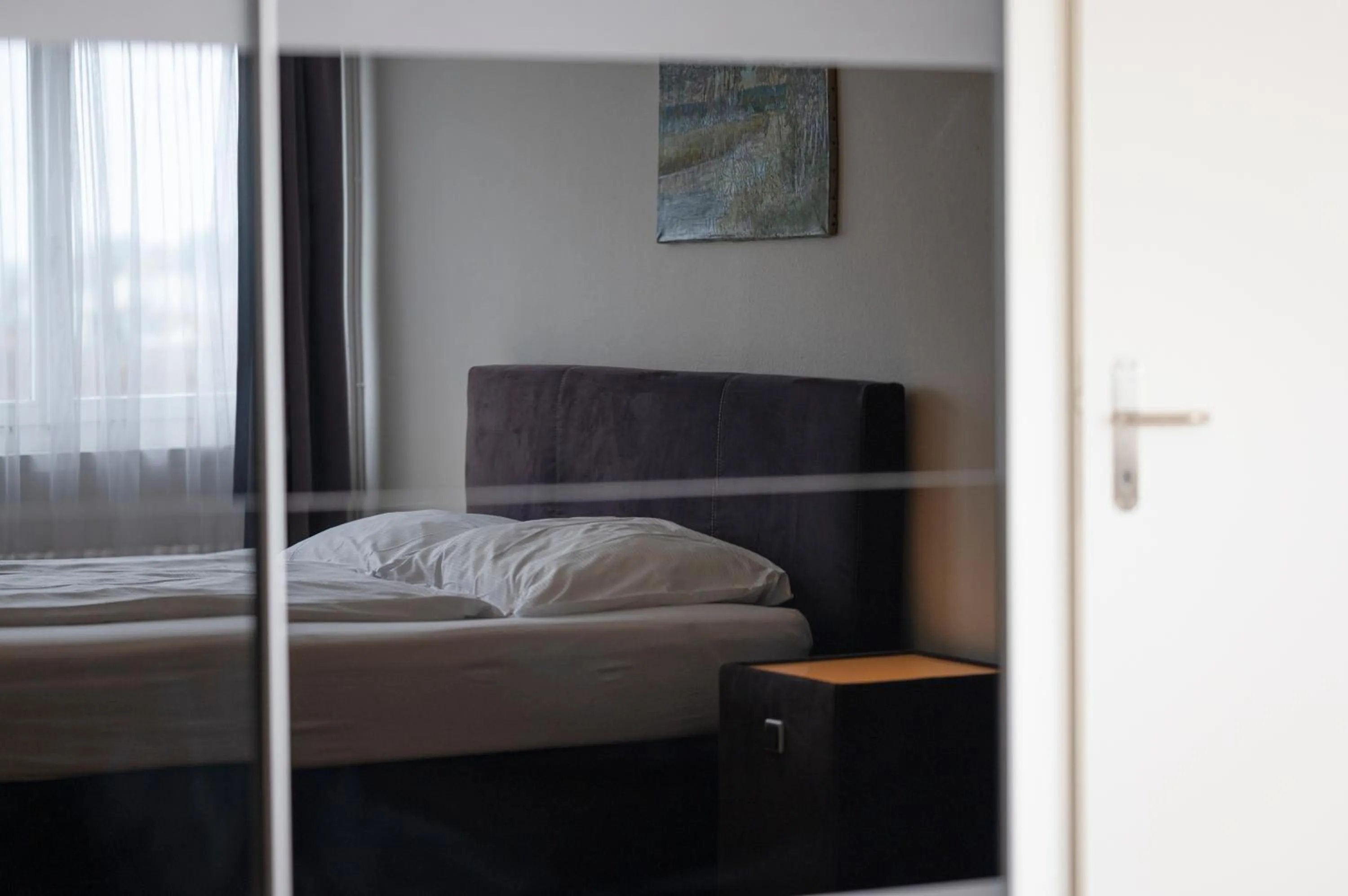 Photo of the whole room, Bed in Amanthos Living Solothurn