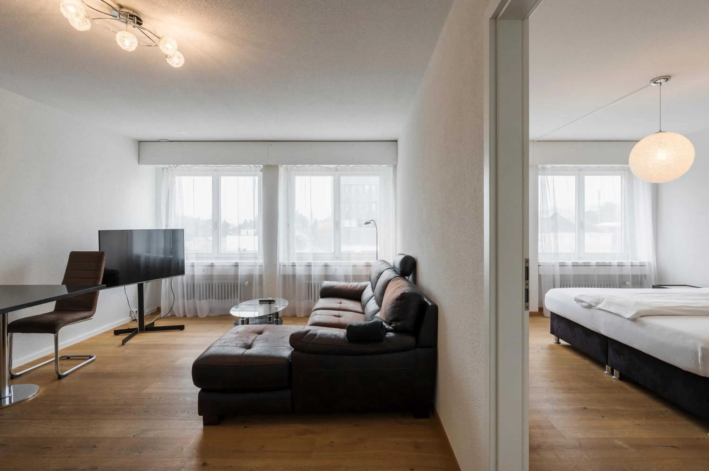Communal lounge/ TV room, Bed in Amanthos Living Solothurn