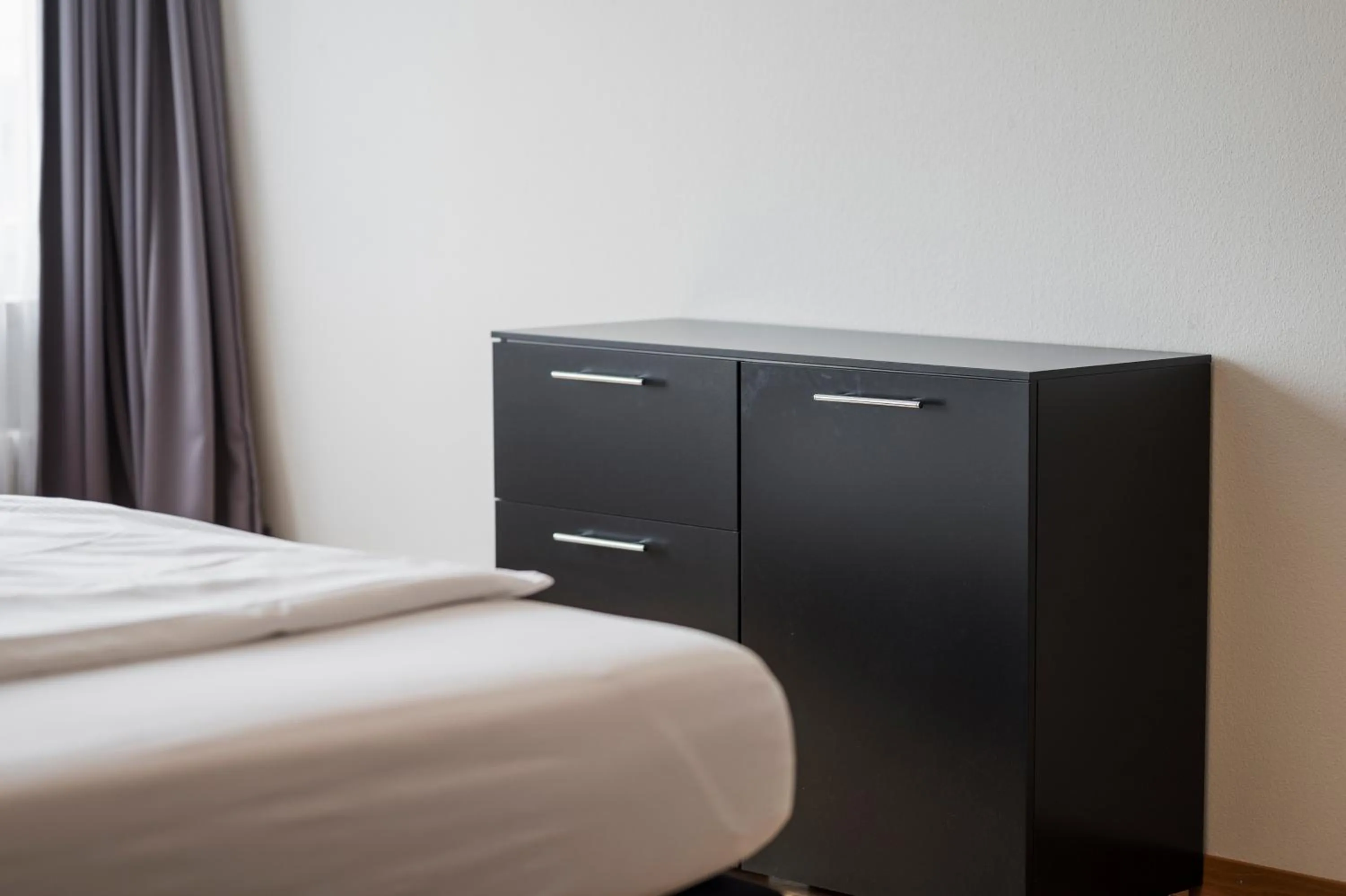 Photo of the whole room, Bed in Amanthos Living Solothurn