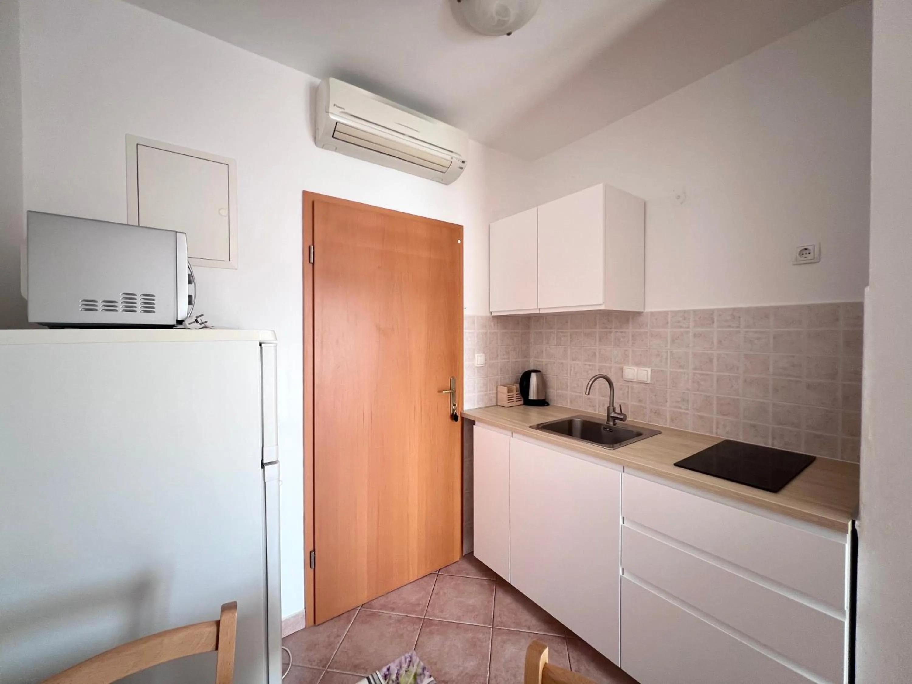 Kitchen or kitchenette in Apartments Palit Rab