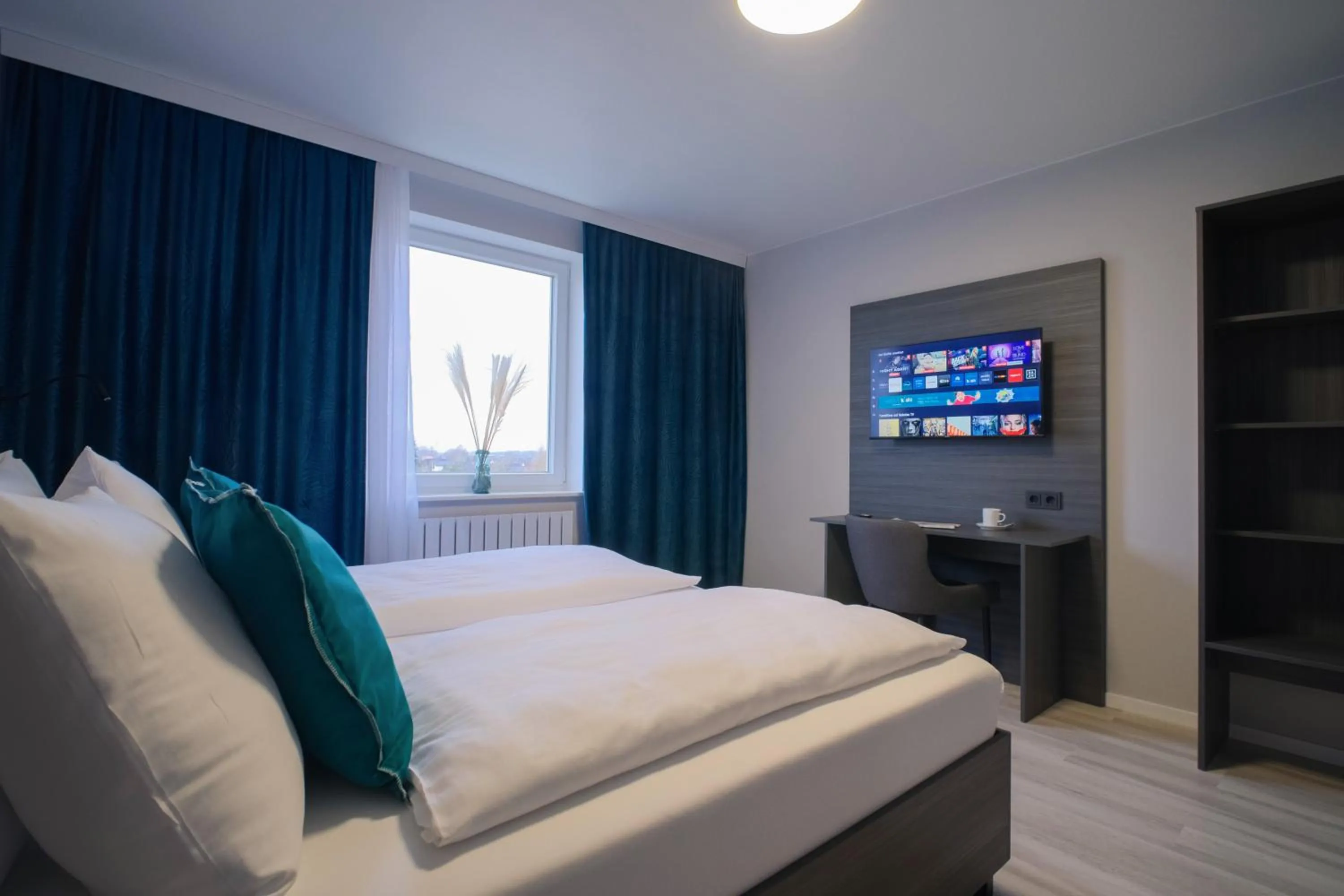 Photo of the whole room, Bed in Hotel Kiel by MELIO