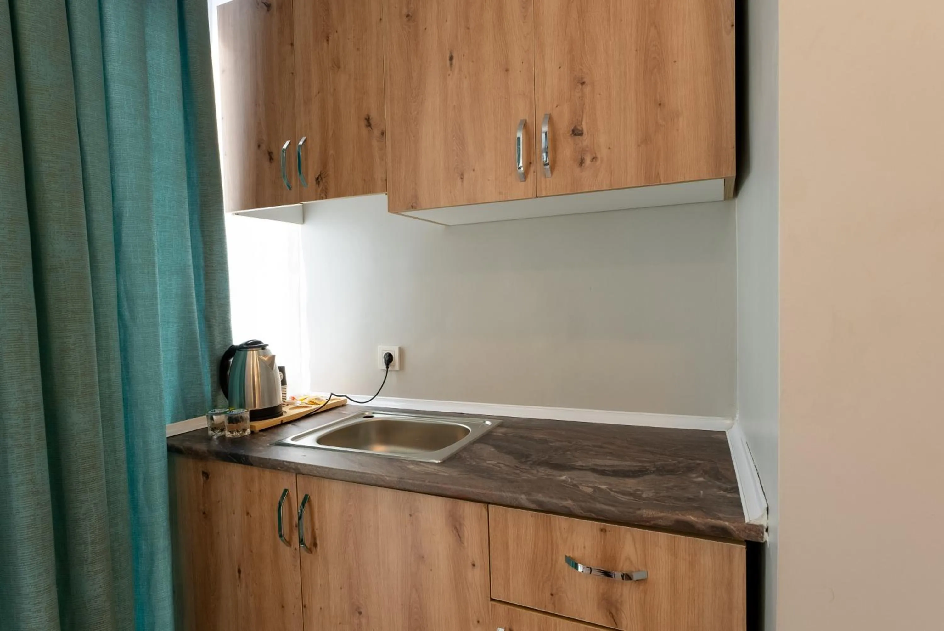 Kitchen or kitchenette in Lacasa Royal Hotel