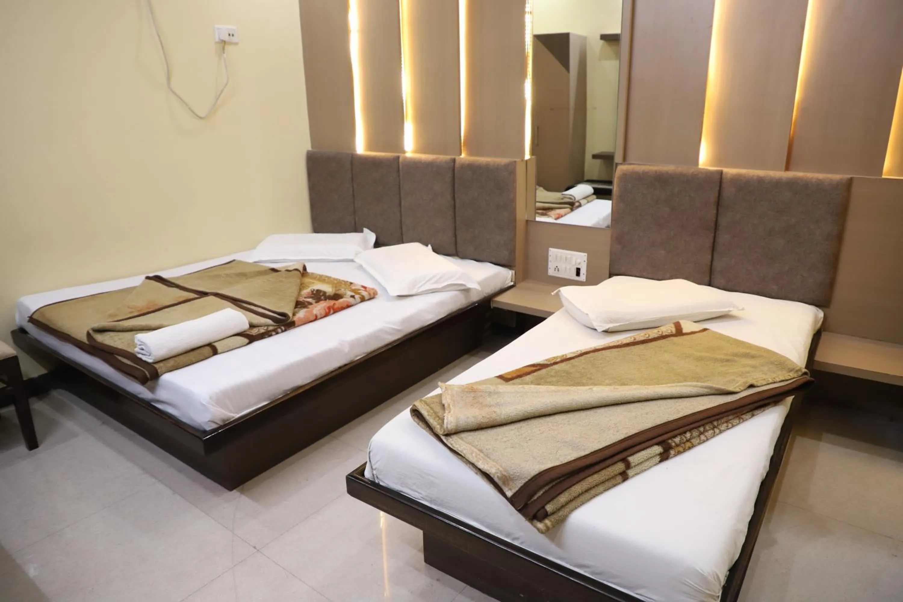 Bed in Hotel Mittal Inn