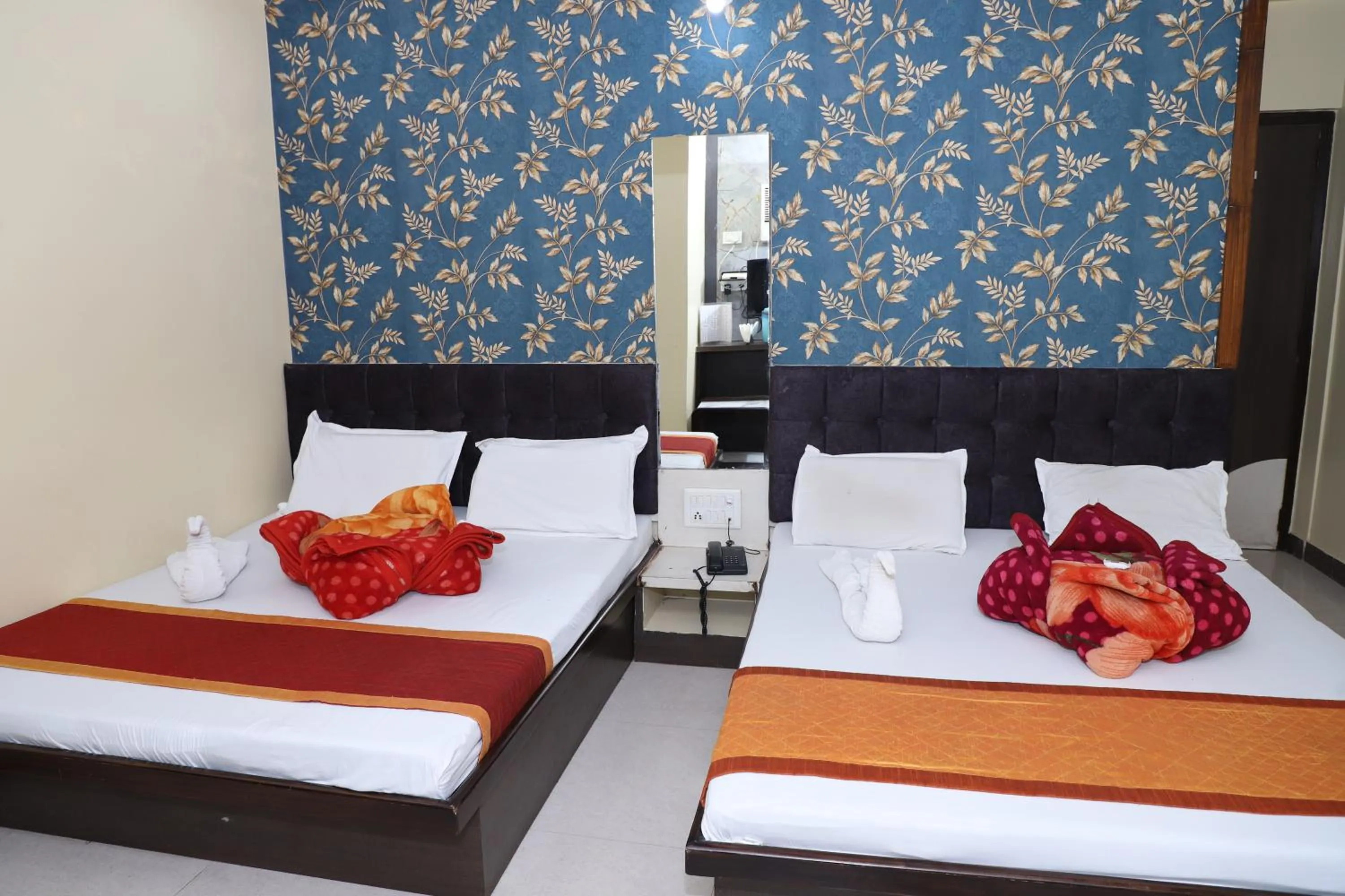 Bed in Hotel Mittal Inn