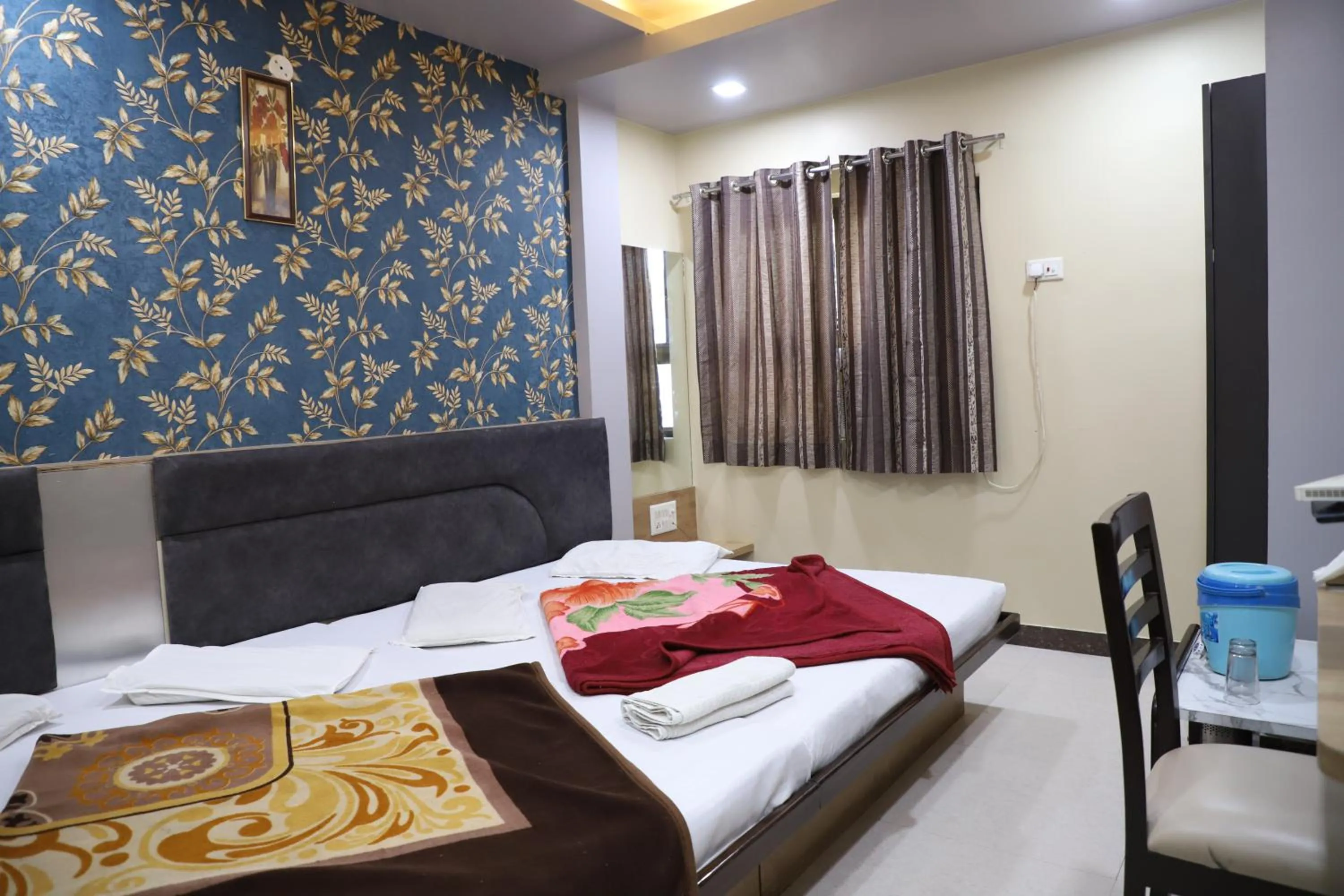 Bed in Hotel Mittal Inn