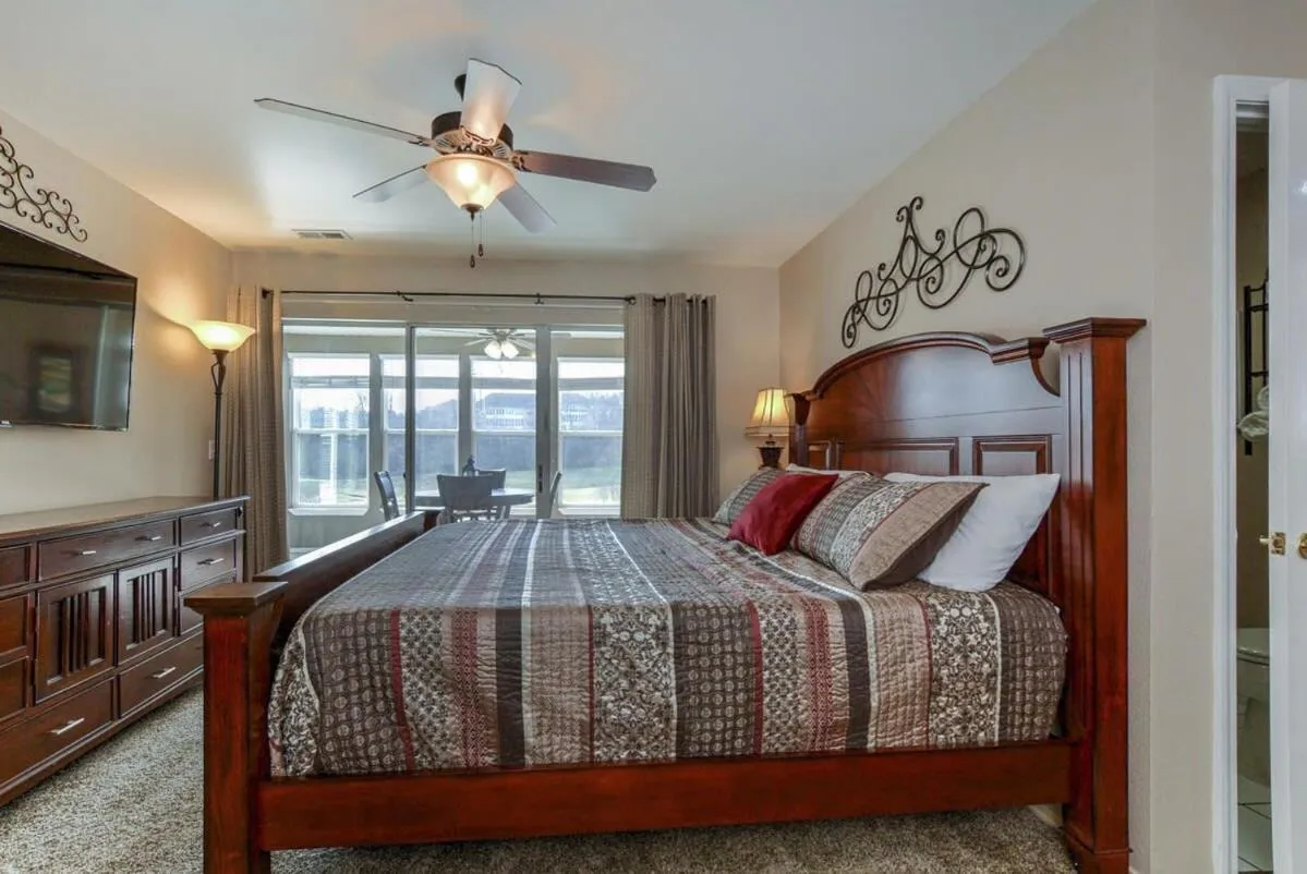 Bed in Little House on the Fairway- Luxury Golf Condo
