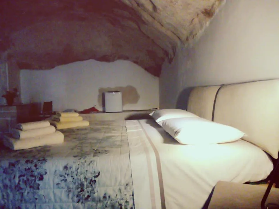 Bed in Alla dimora di Chiara Suite and Rooms