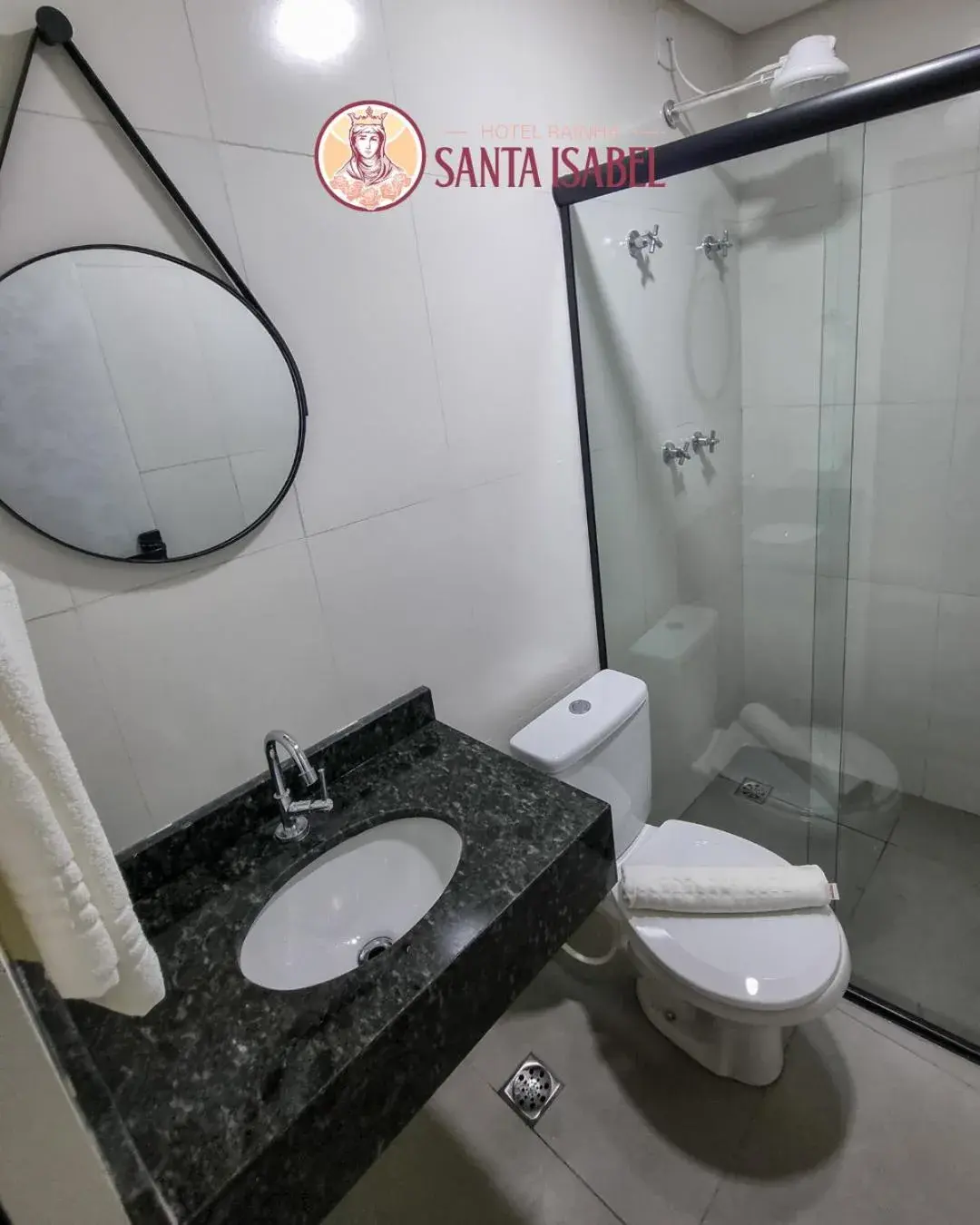 Basic Triple Room in Hotel Rainha Santa Isabel Basic Triple Room in Hotel Rainha Santa Isabel