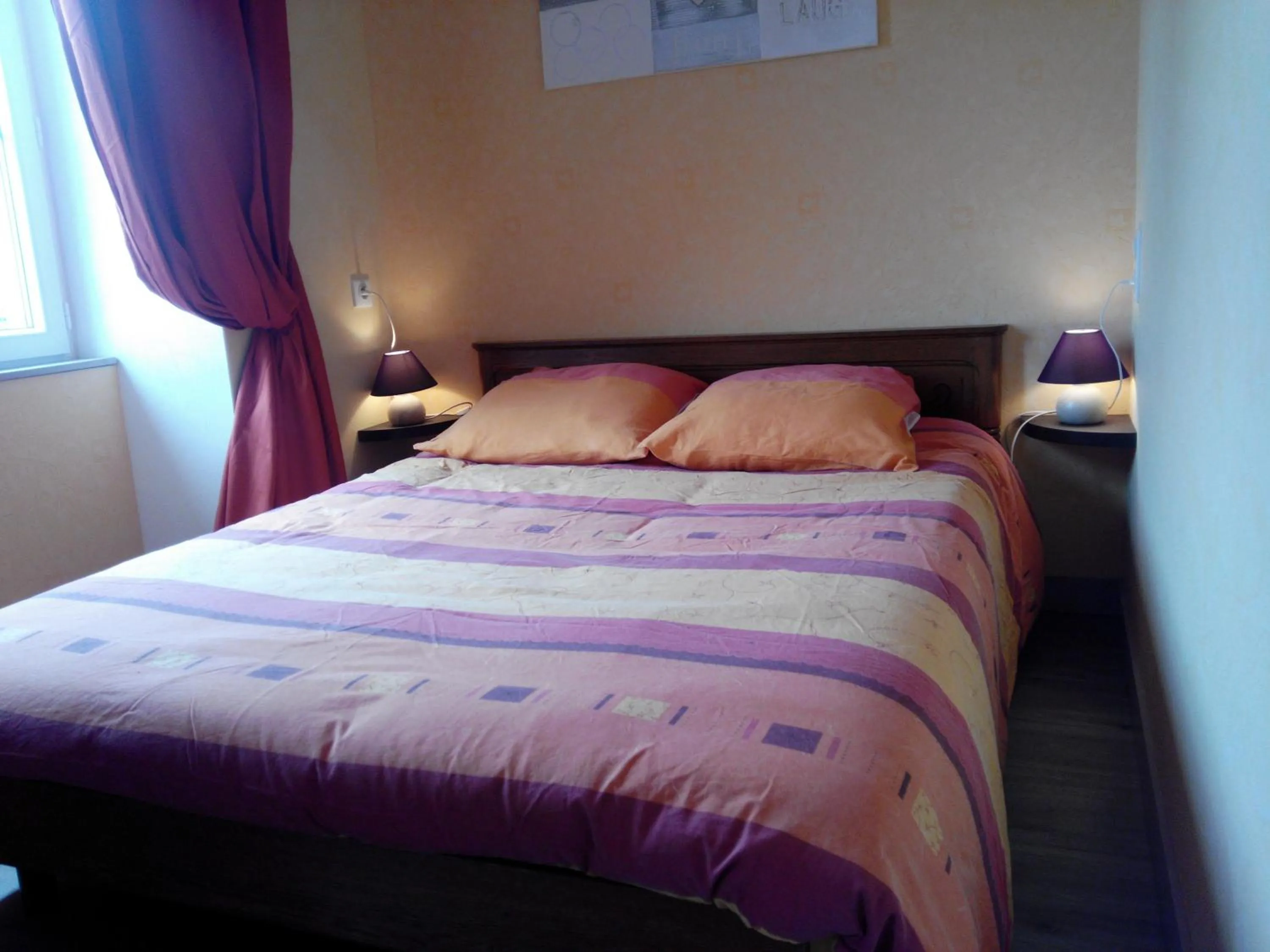 Bed in Chambres d'hôtes -- Le Clos de Gémozac