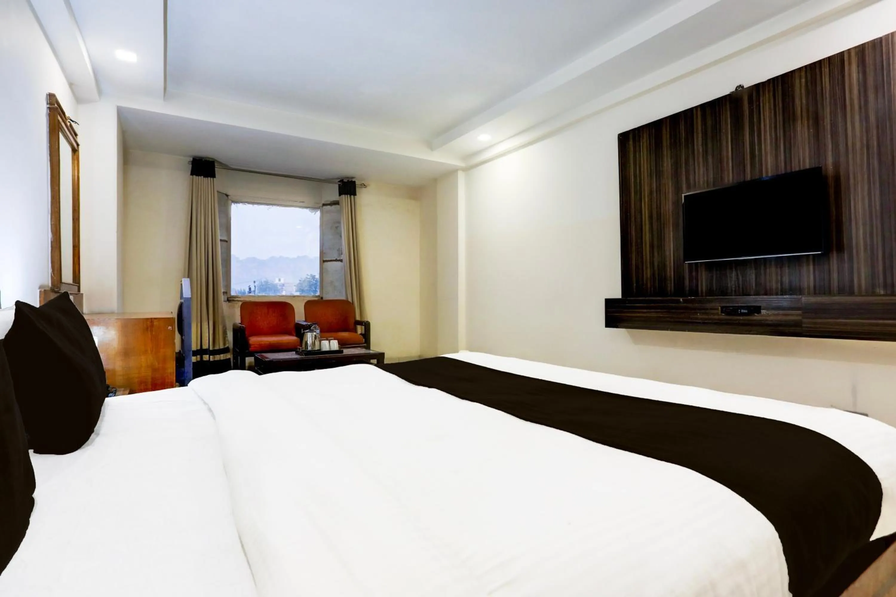 Bedroom, Bed in Super Townhouse Padav Square Gwalior Formerly Hotel Shelter