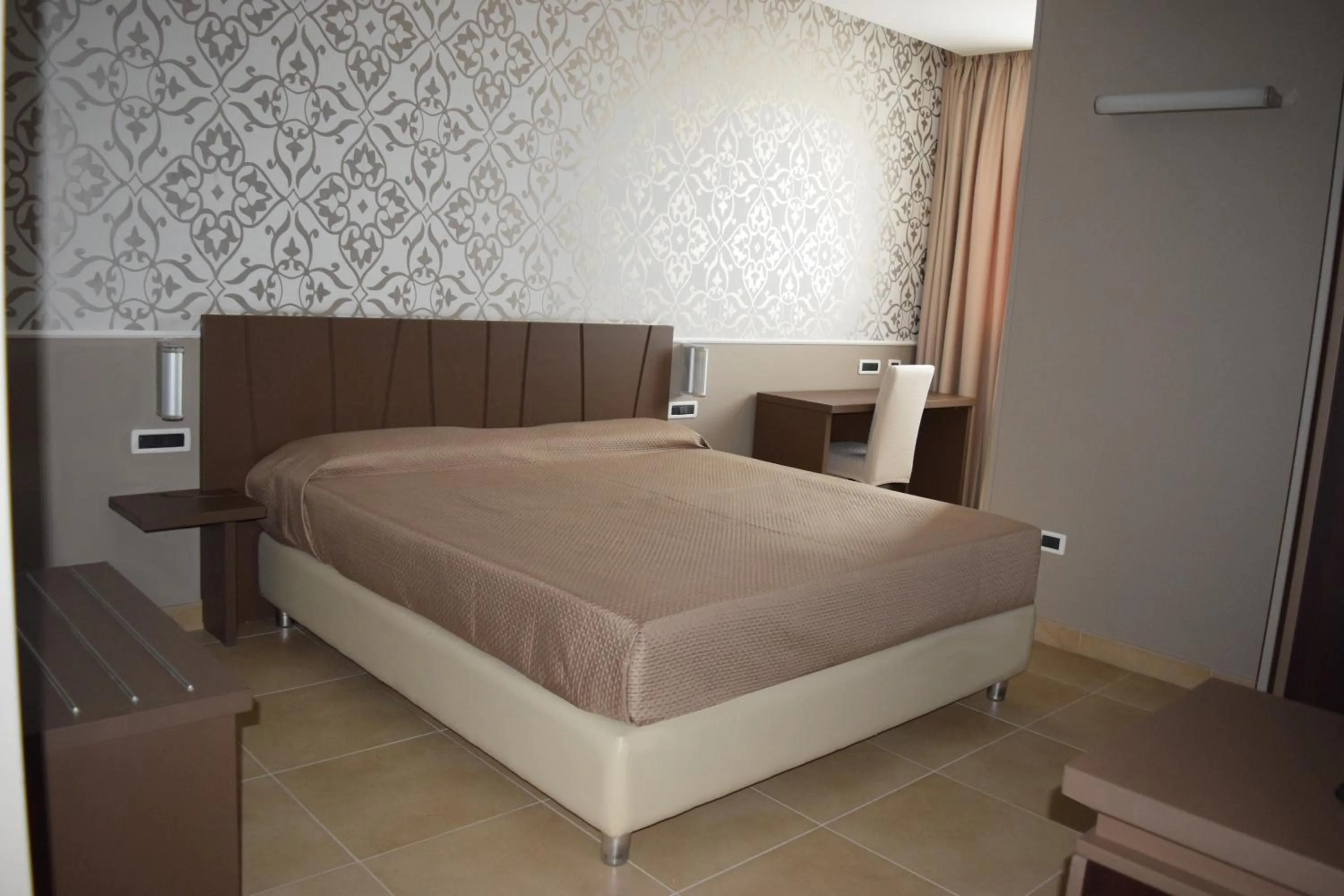 Bed in Sunrise Hotel