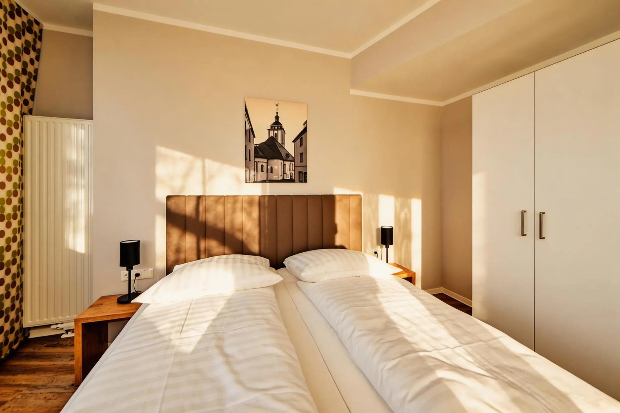 Bed in ADAPT APARTMENT HOTEL Siegen