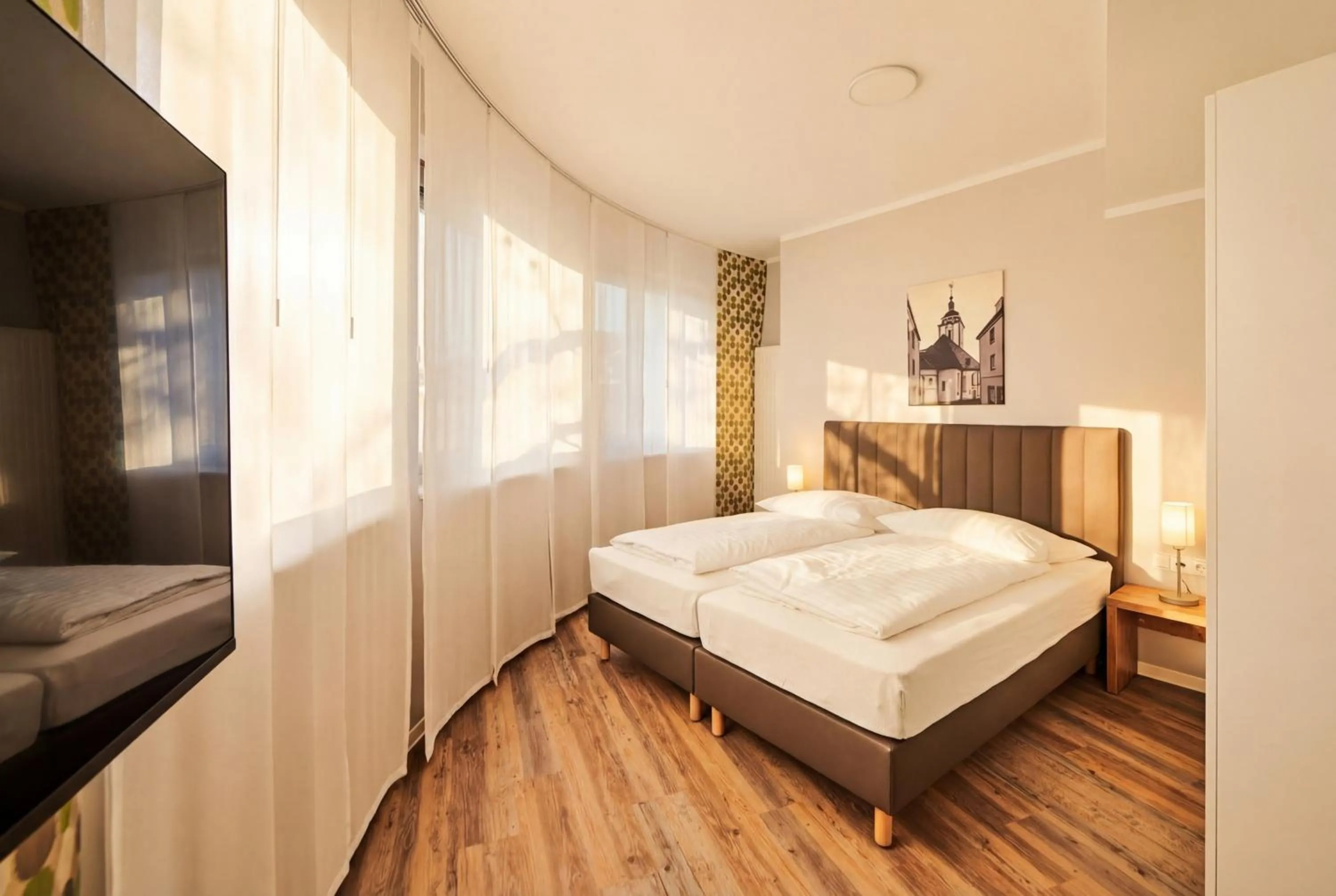 Bed in ADAPT APARTMENT HOTEL Siegen