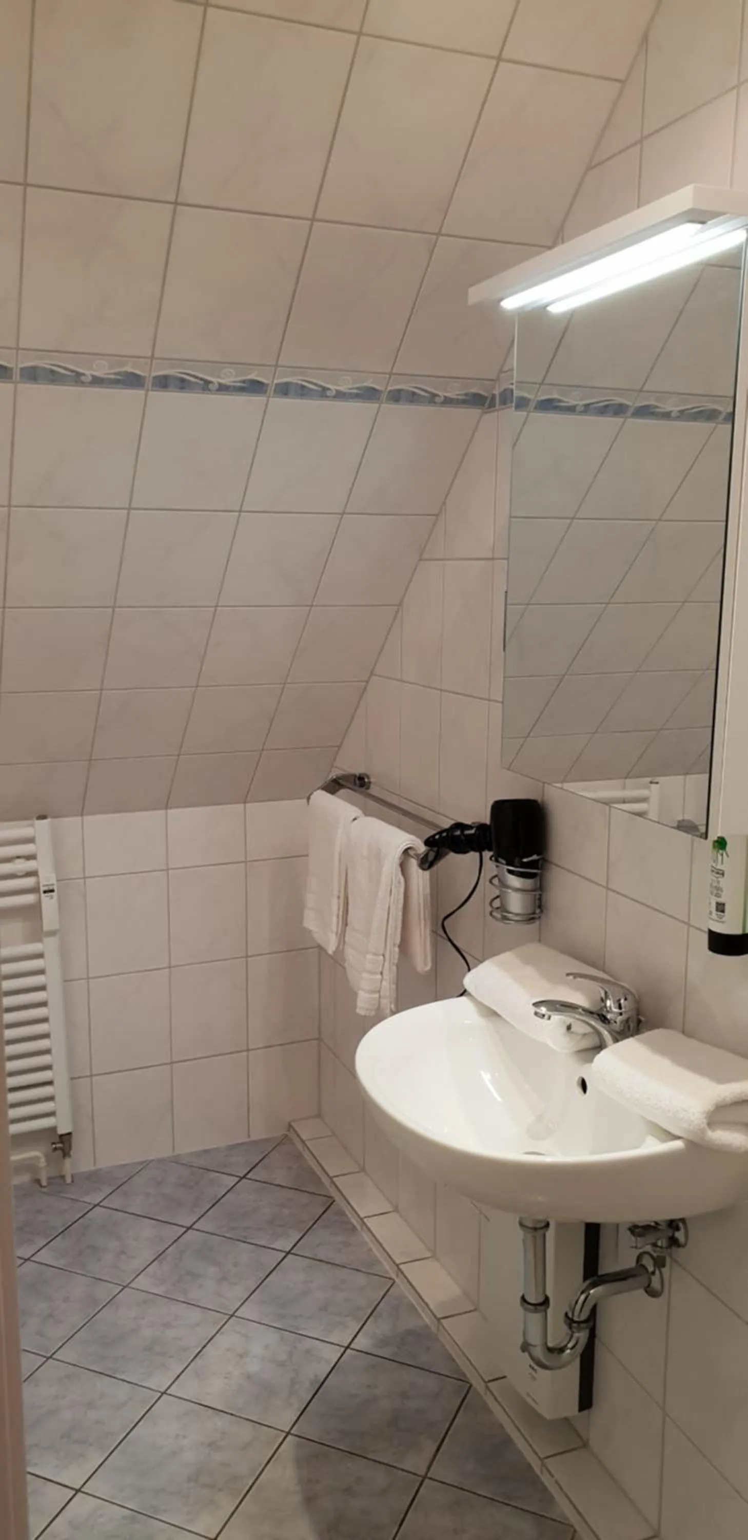 Bathroom in Airport Hotel One Aparthotel Sylt