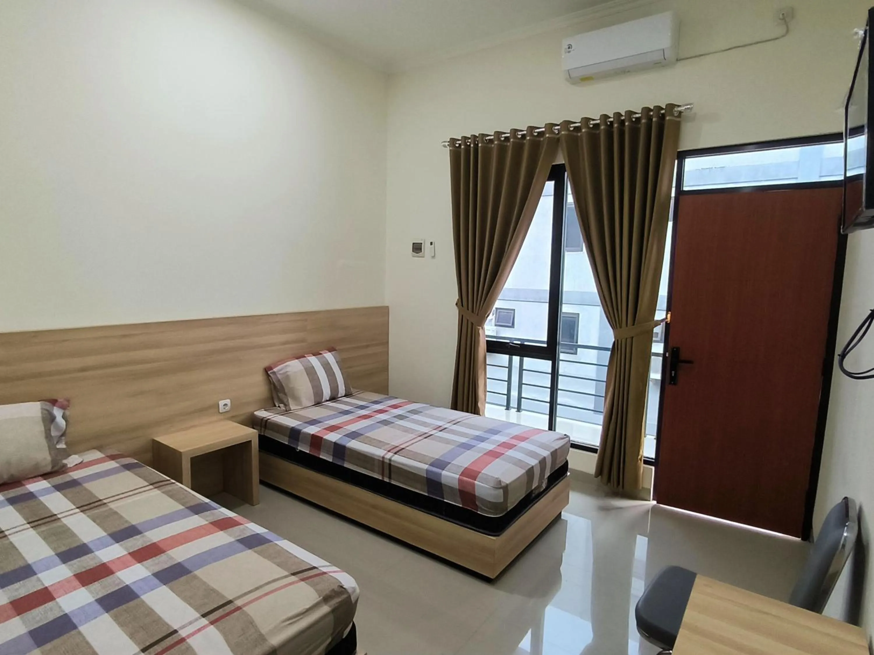 Bed in Tentrem Guesthouse Baru
