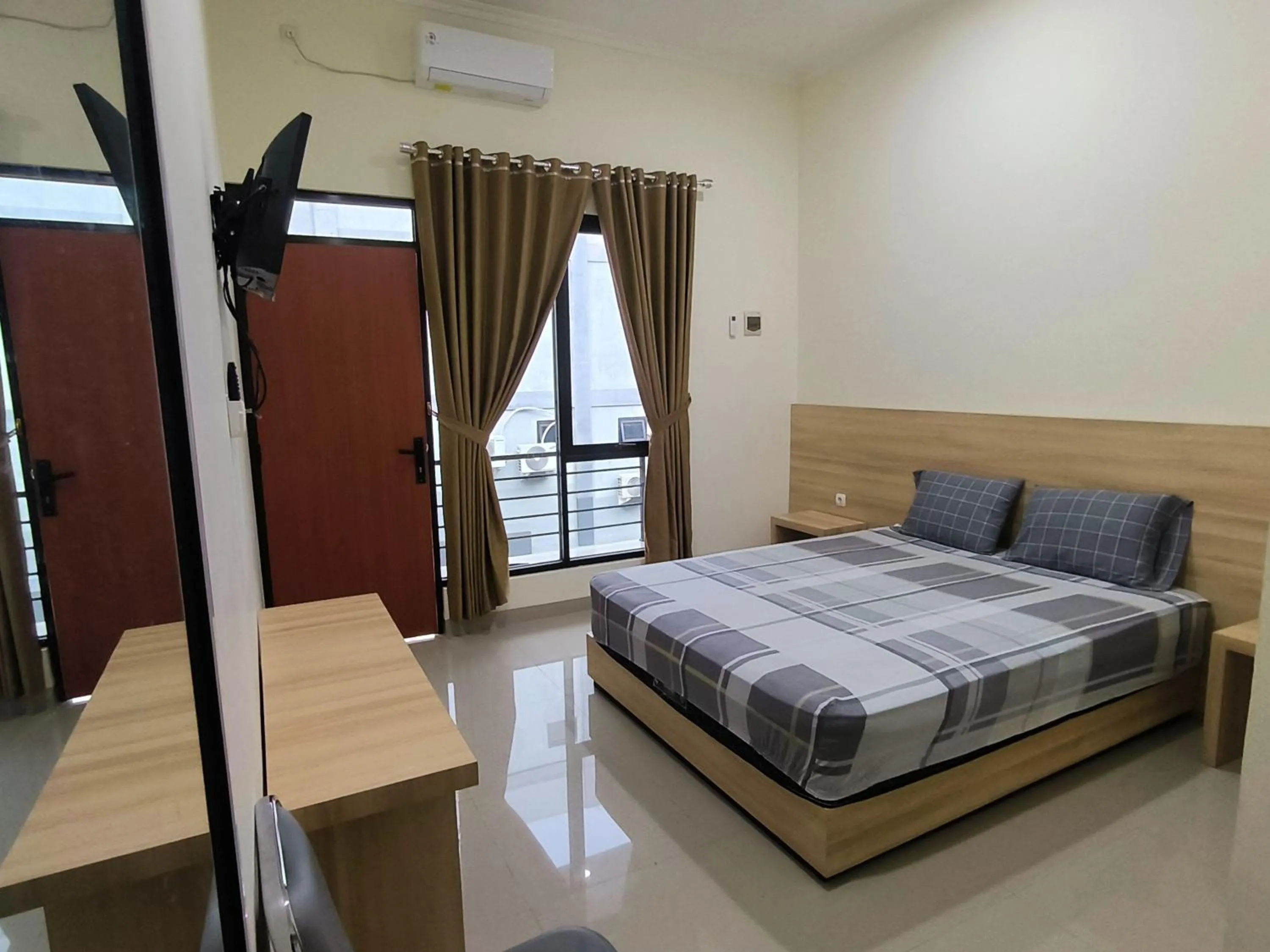 Bed in Tentrem Guesthouse Baru
