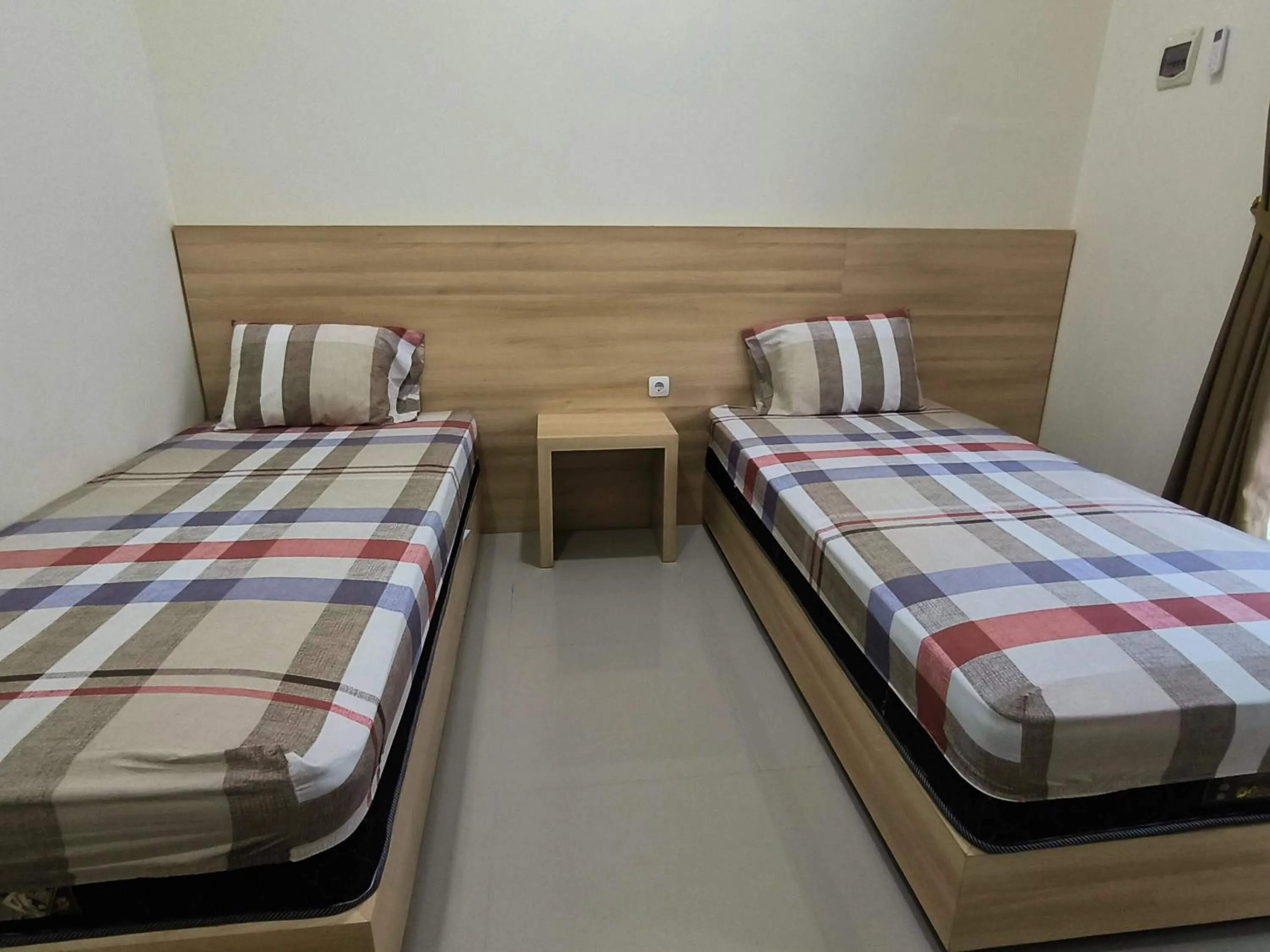 Bed in Tentrem Guesthouse Baru