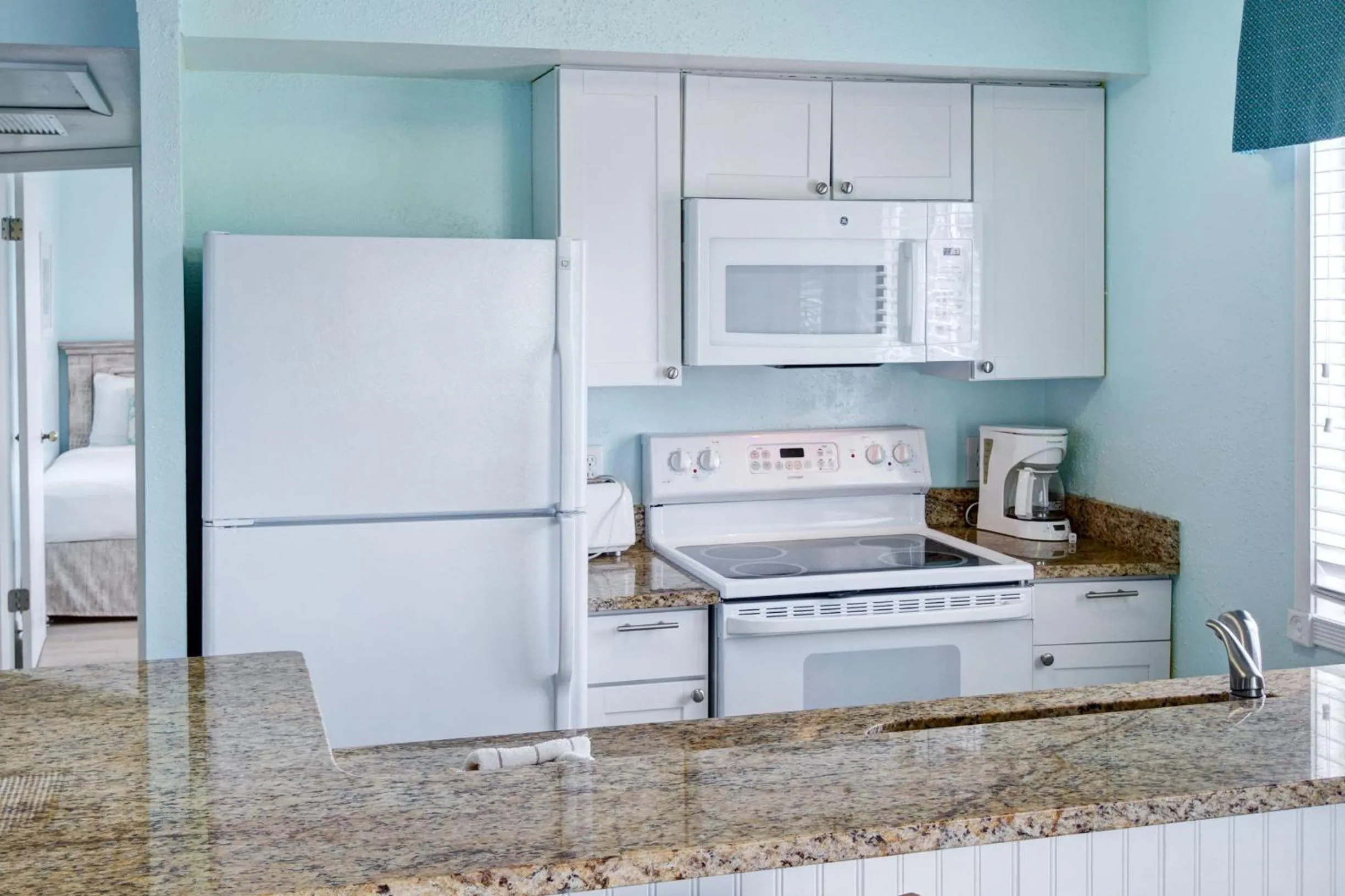 kitchen in New Smyrna Waves by Exploria Resorts