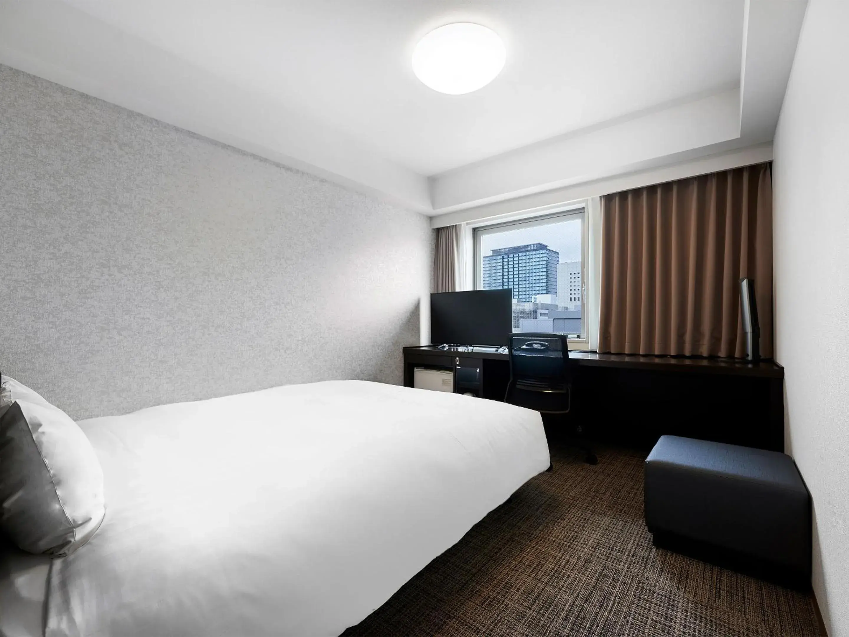 Bed in Daiwa Roynet Hotel Kawasaki Bed in Daiwa Roynet Hotel Kawasaki