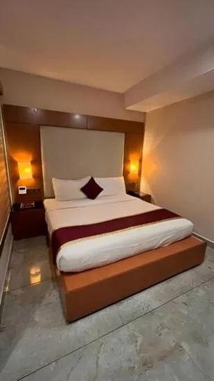 Bed in The Garuda Hotels