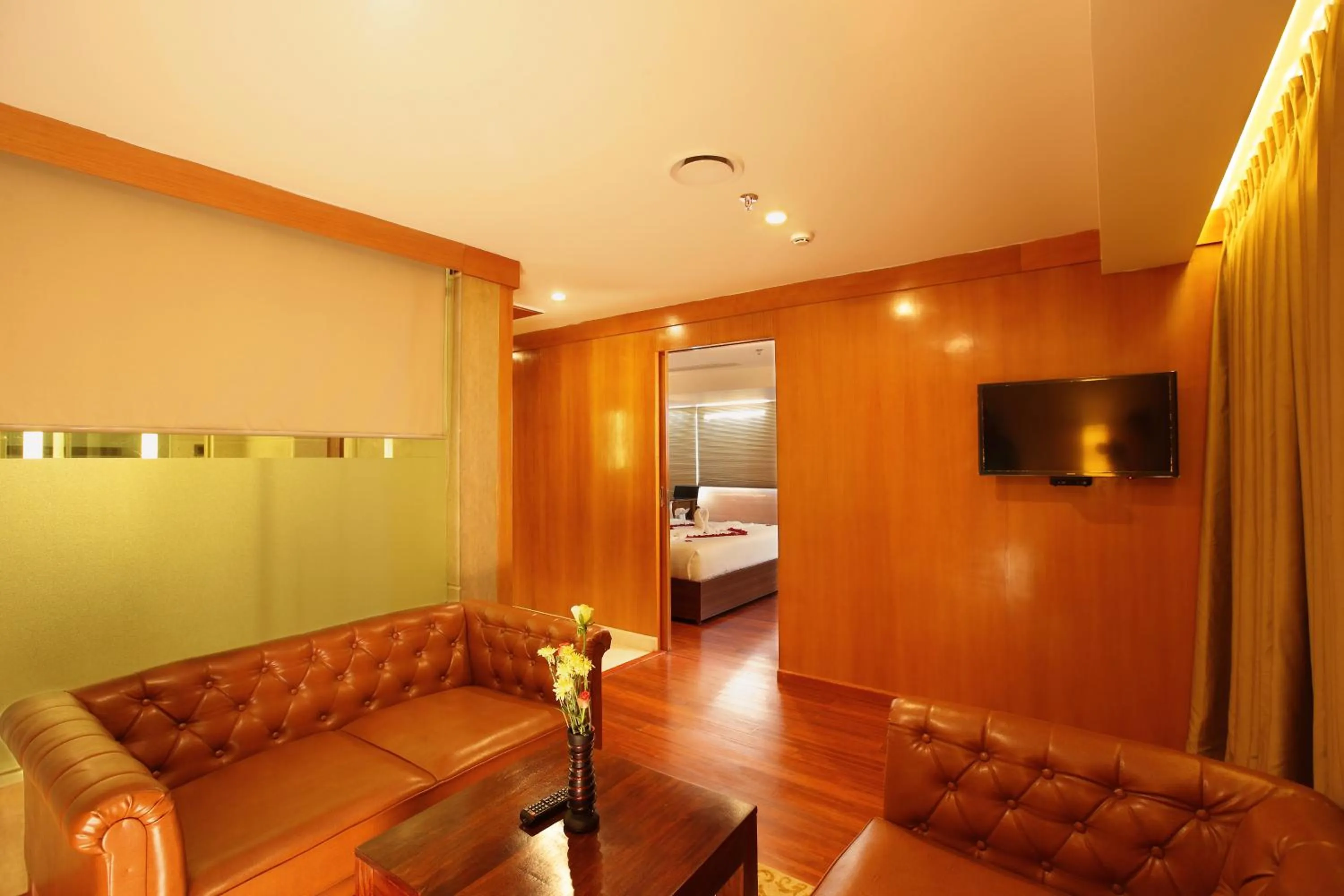 Communal lounge/ TV room in The Garuda Hotels