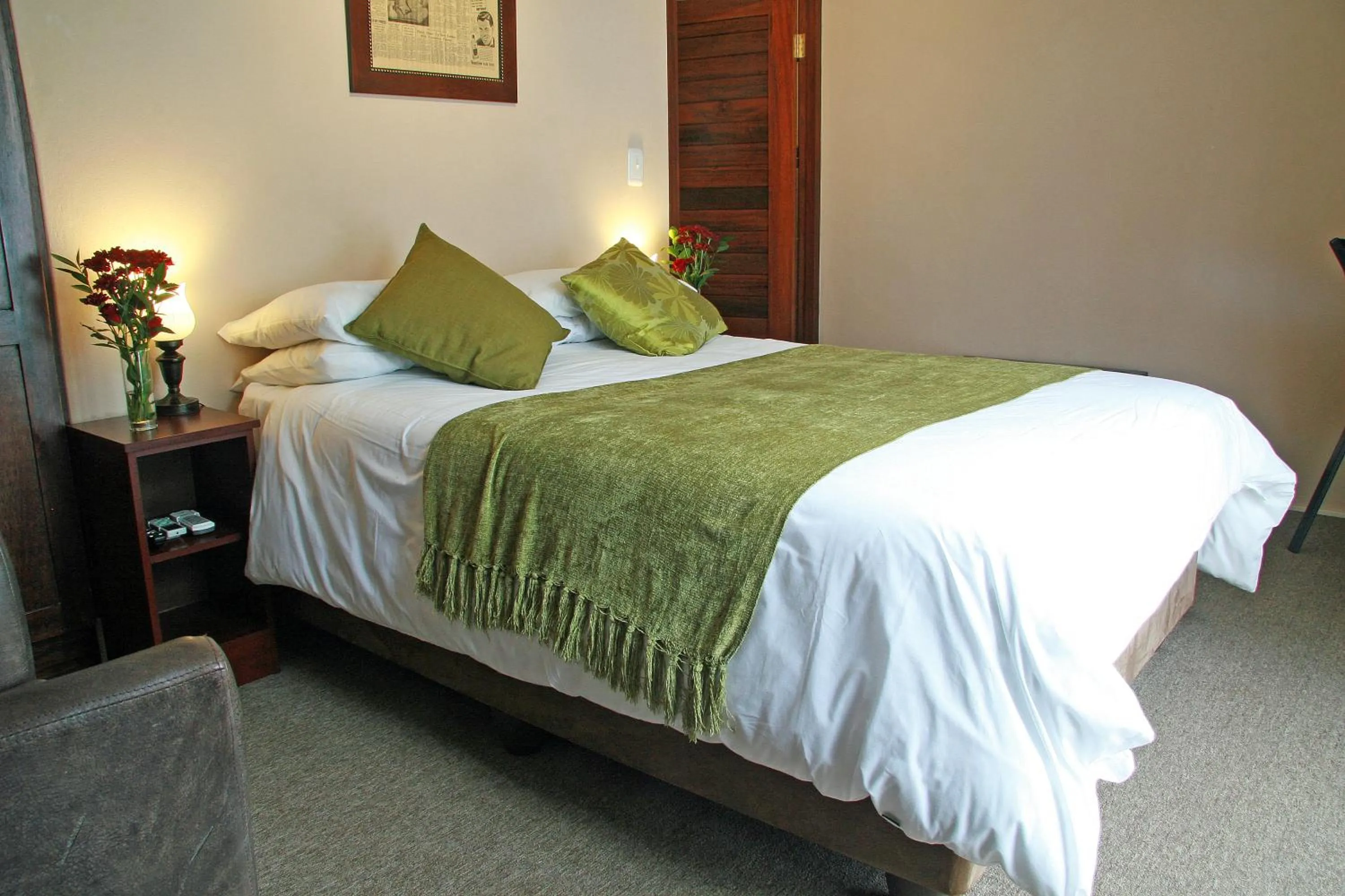 Bed in Queen Manor Boutique Guest House
