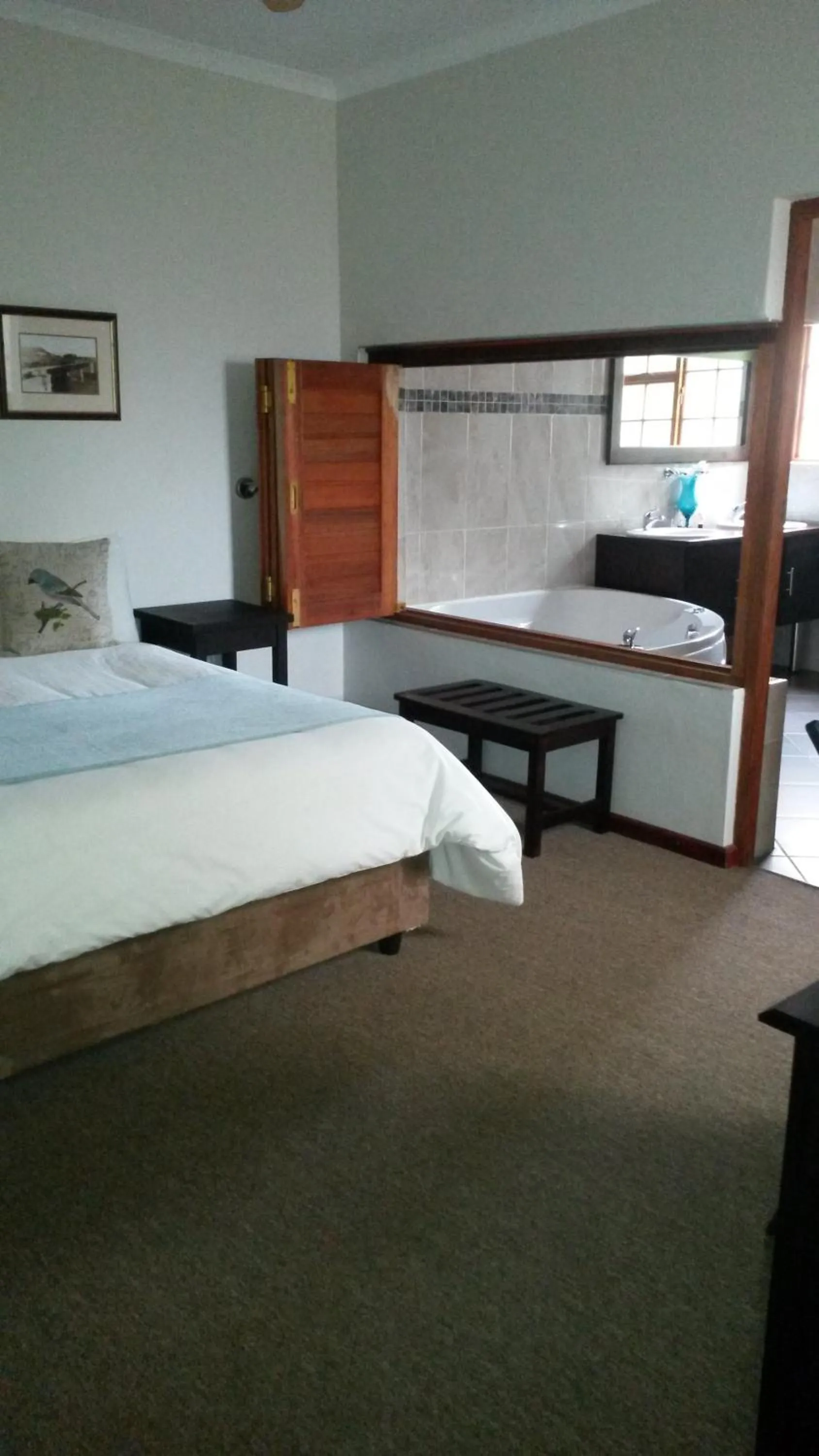 Bed in Queen Manor Boutique Guest House