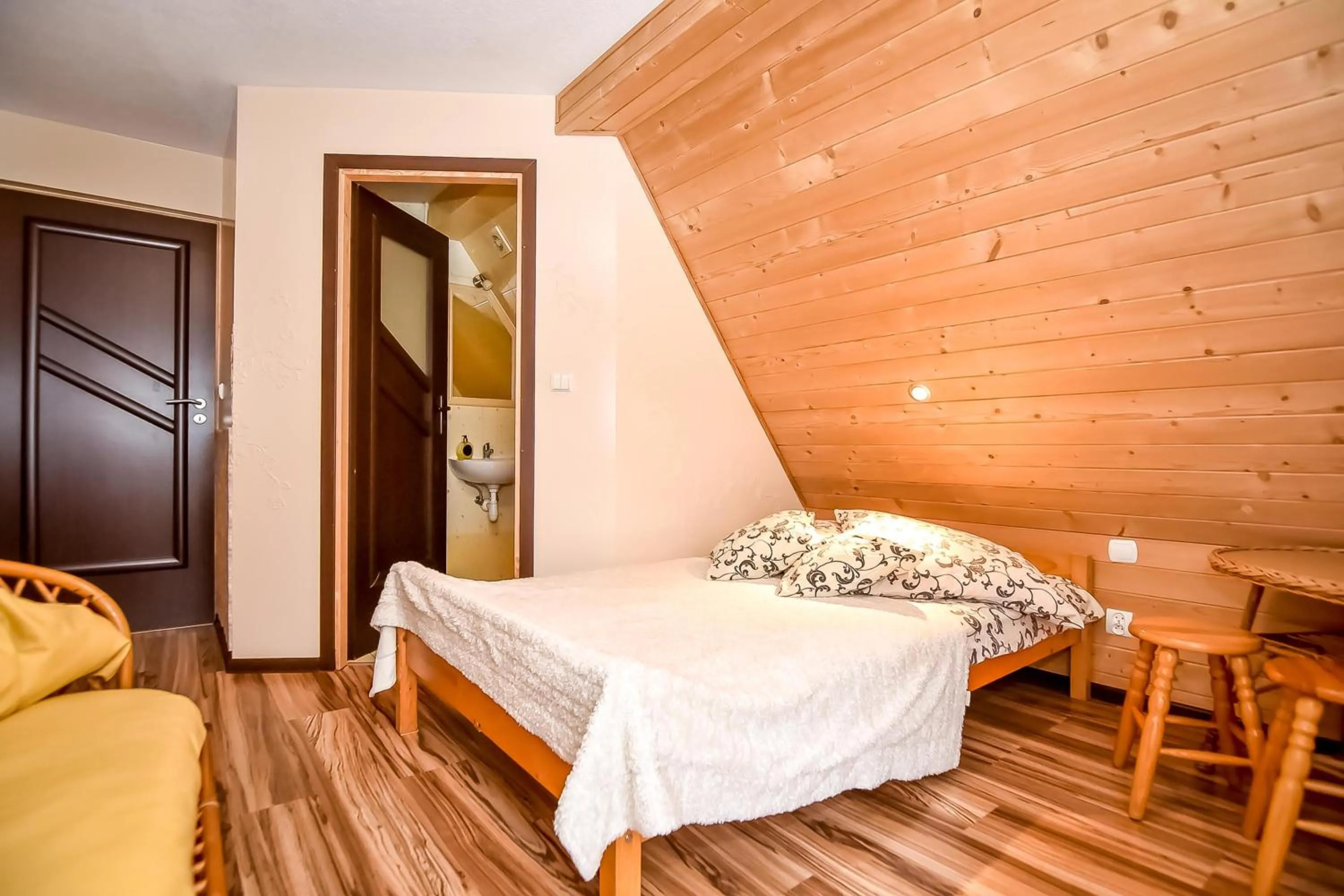 Bed in Ciukrowa Chatka Sauna & Jacuzzi