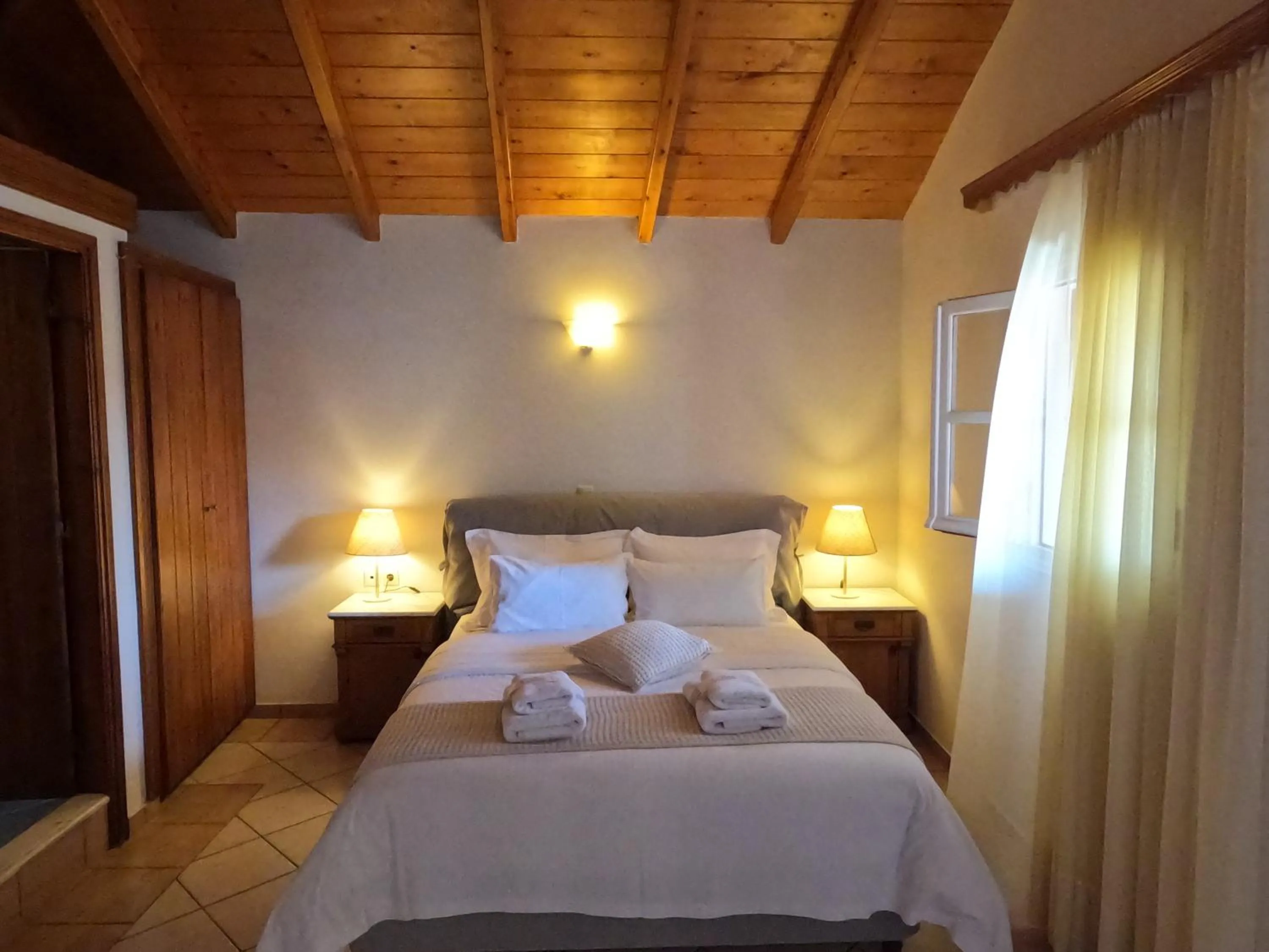 Bed in The Flower Of Monemvasia Hotel