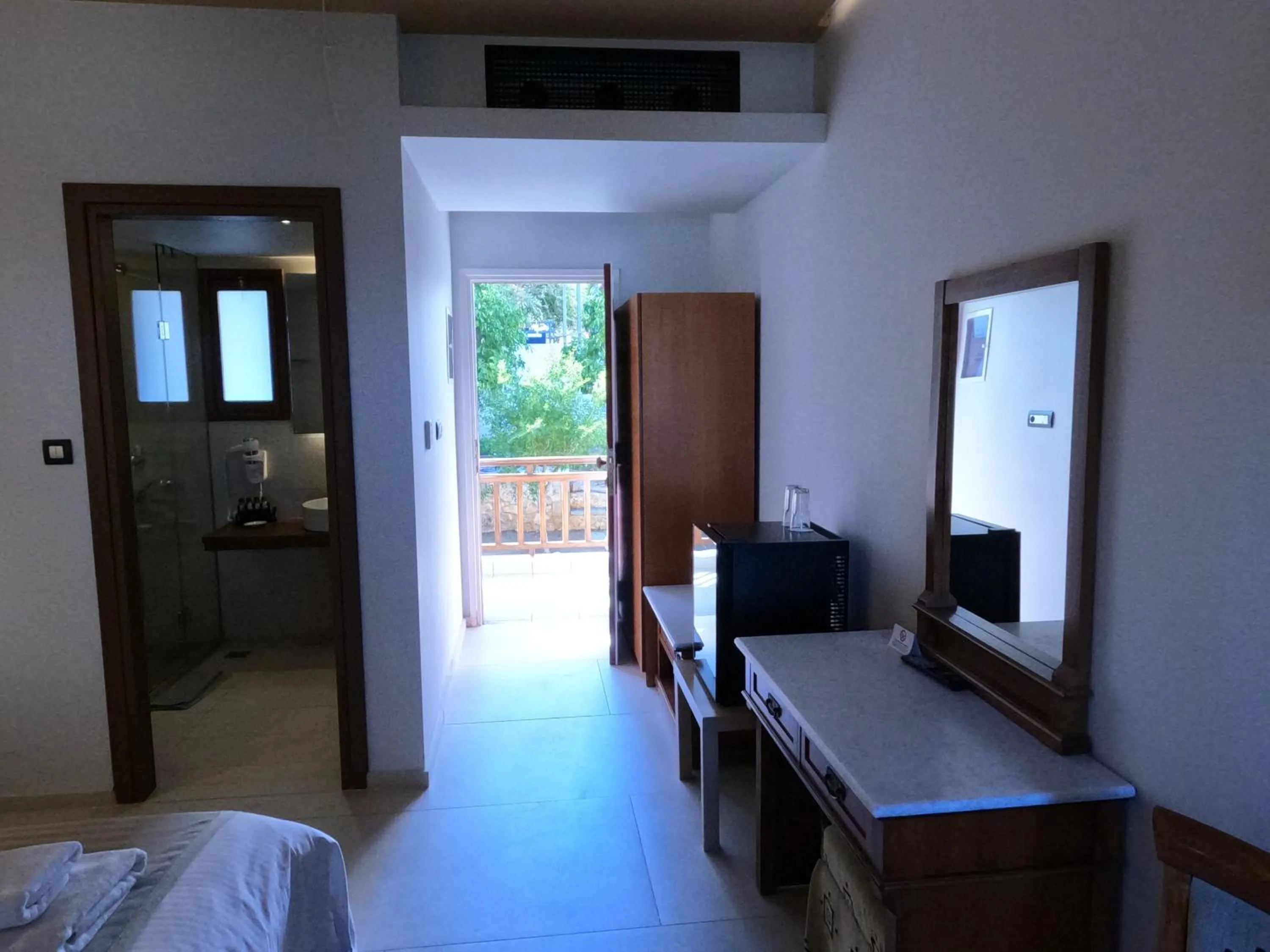 Bed in The Flower Of Monemvasia Hotel