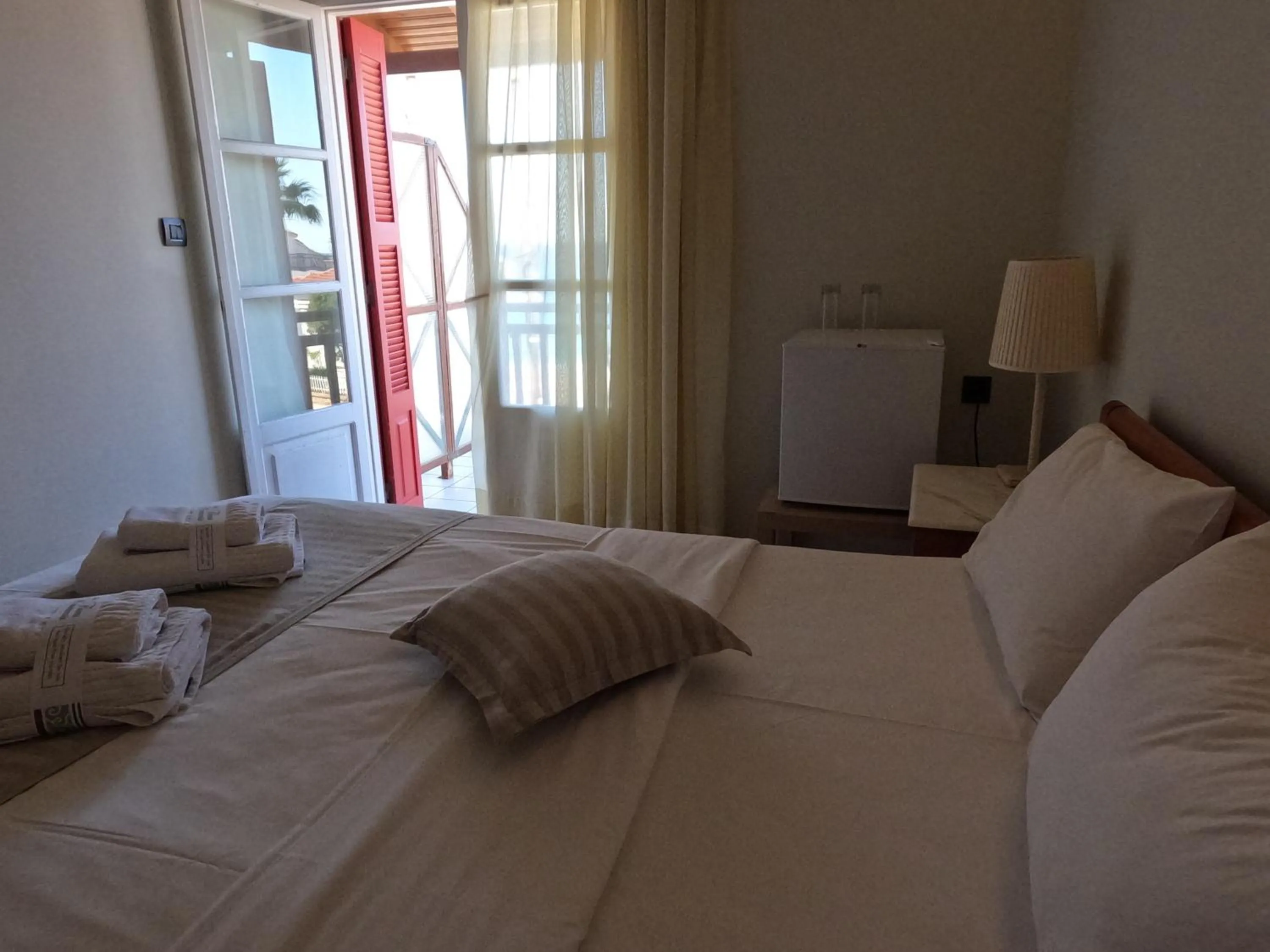 Bed in The Flower Of Monemvasia Hotel