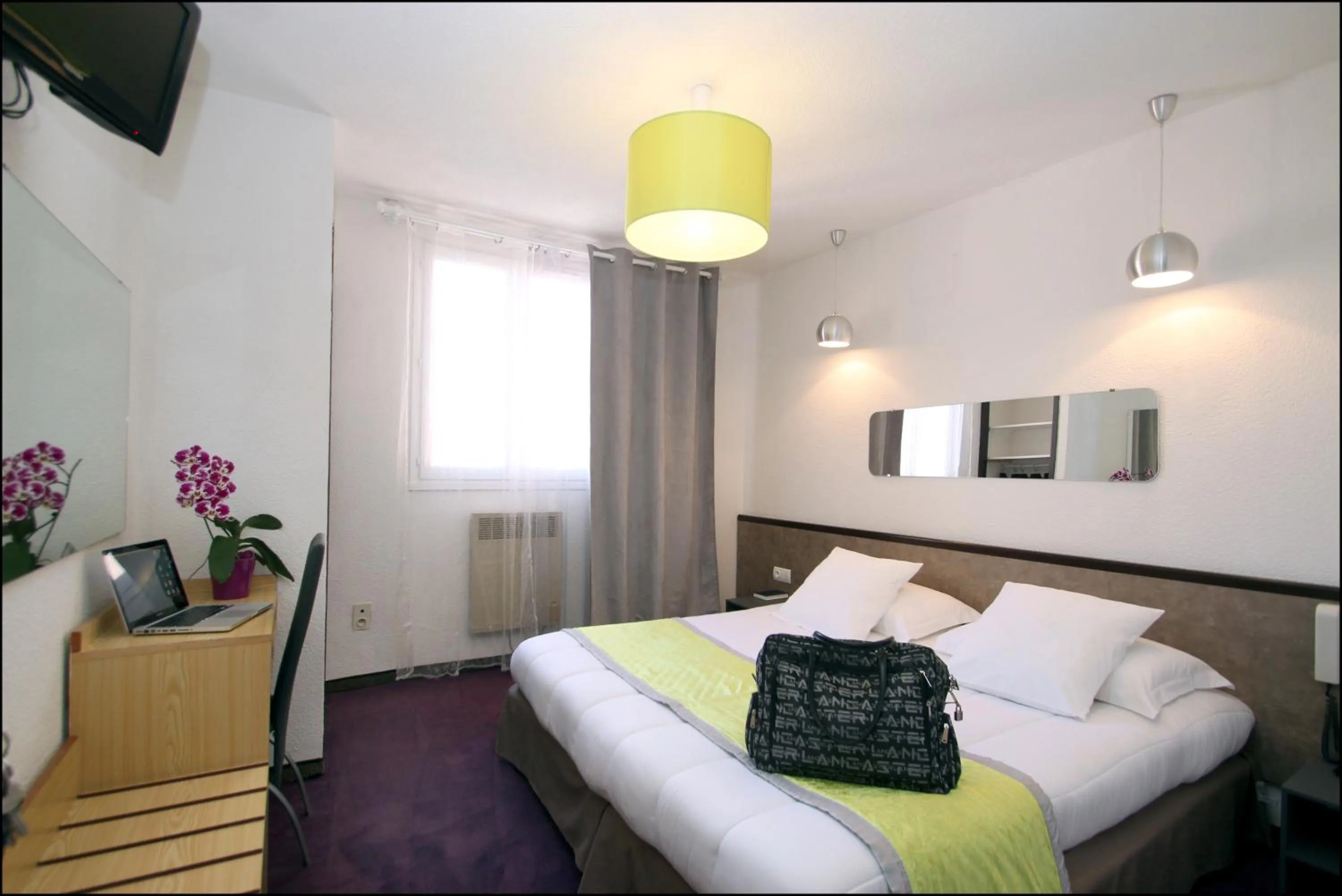 Photo of the whole room, Bed in Hôtel Peyramale