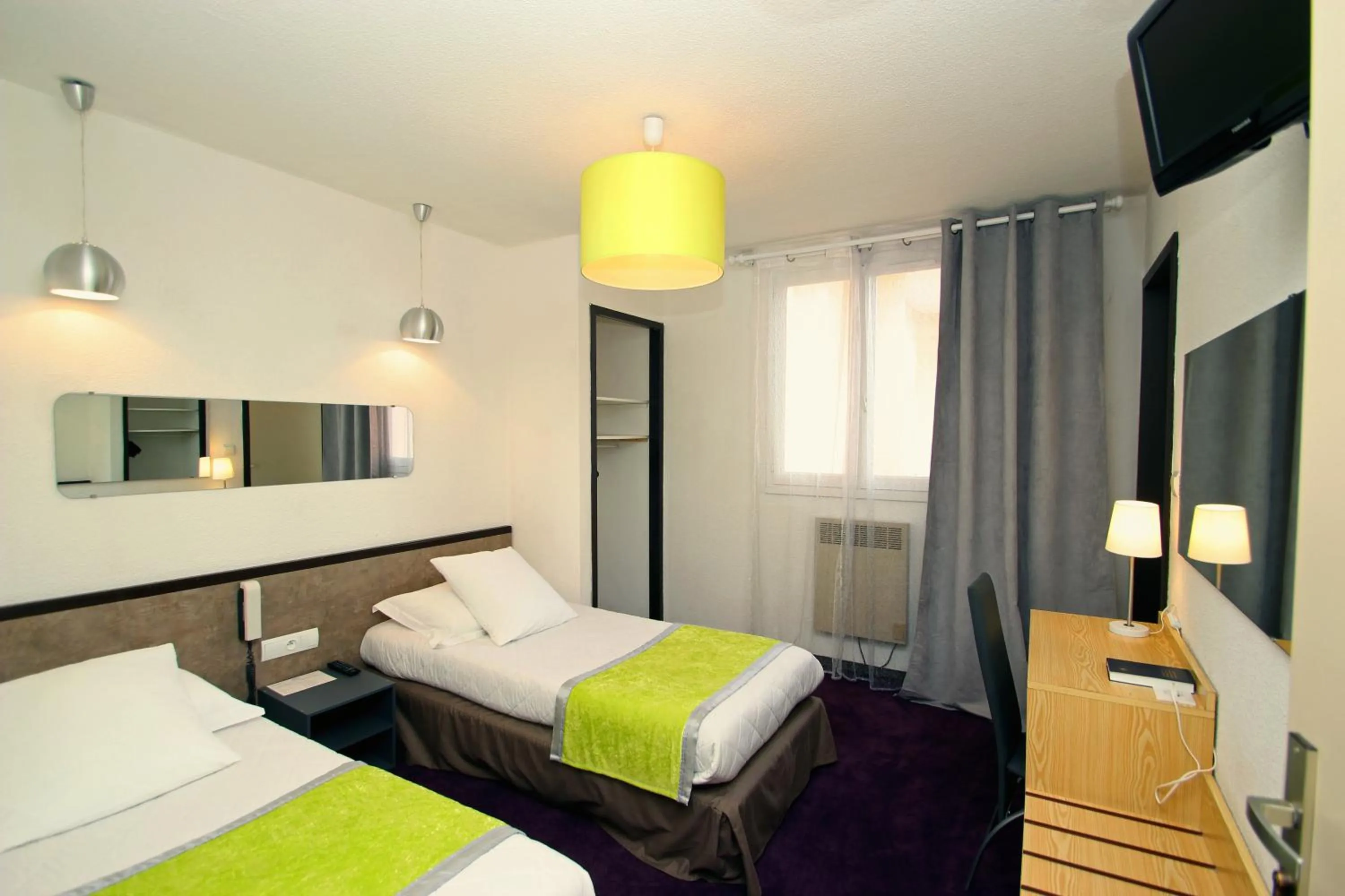 Photo of the whole room, Bed in Hôtel Peyramale