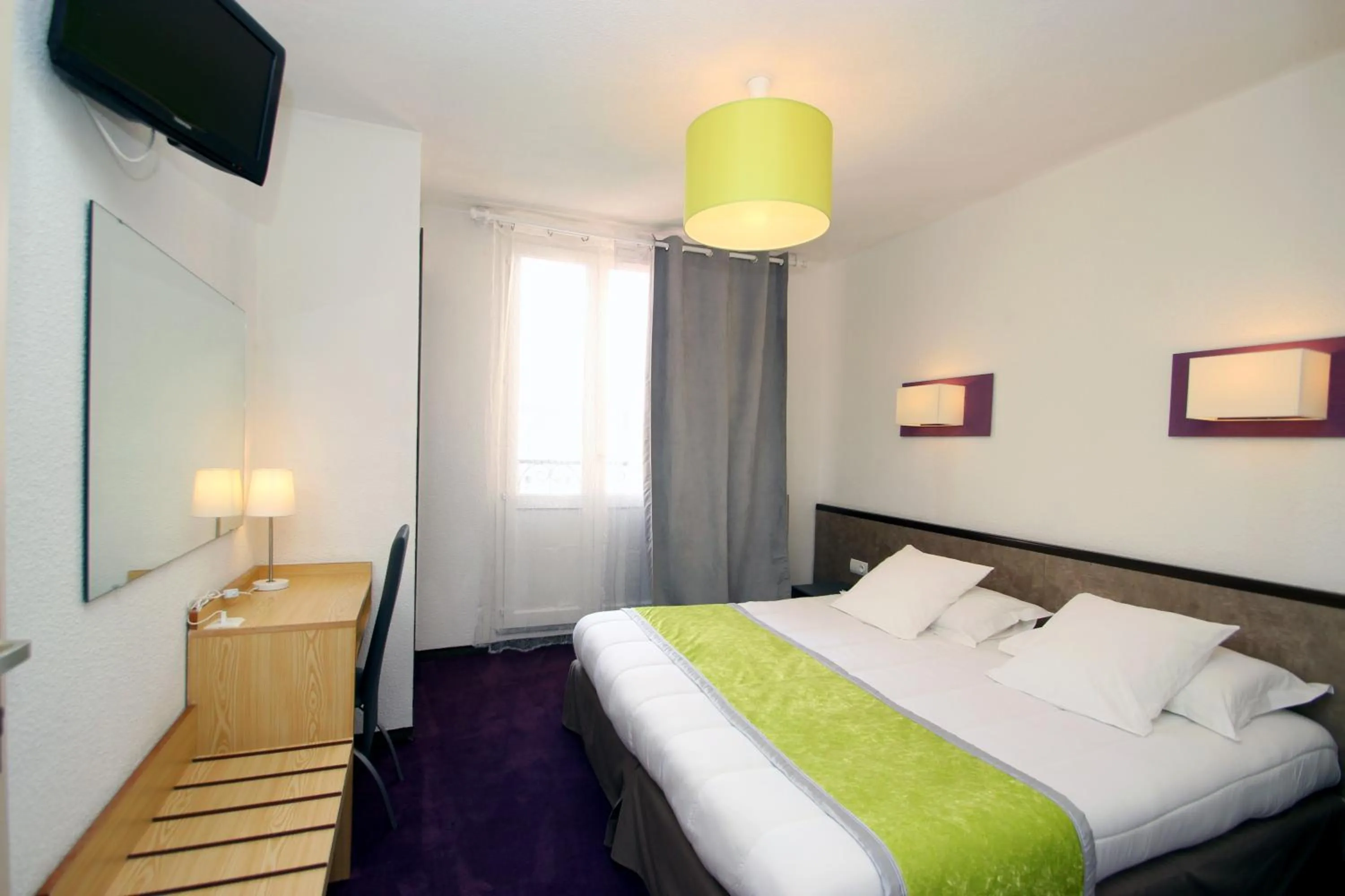 Photo of the whole room, Bed in Hôtel Peyramale