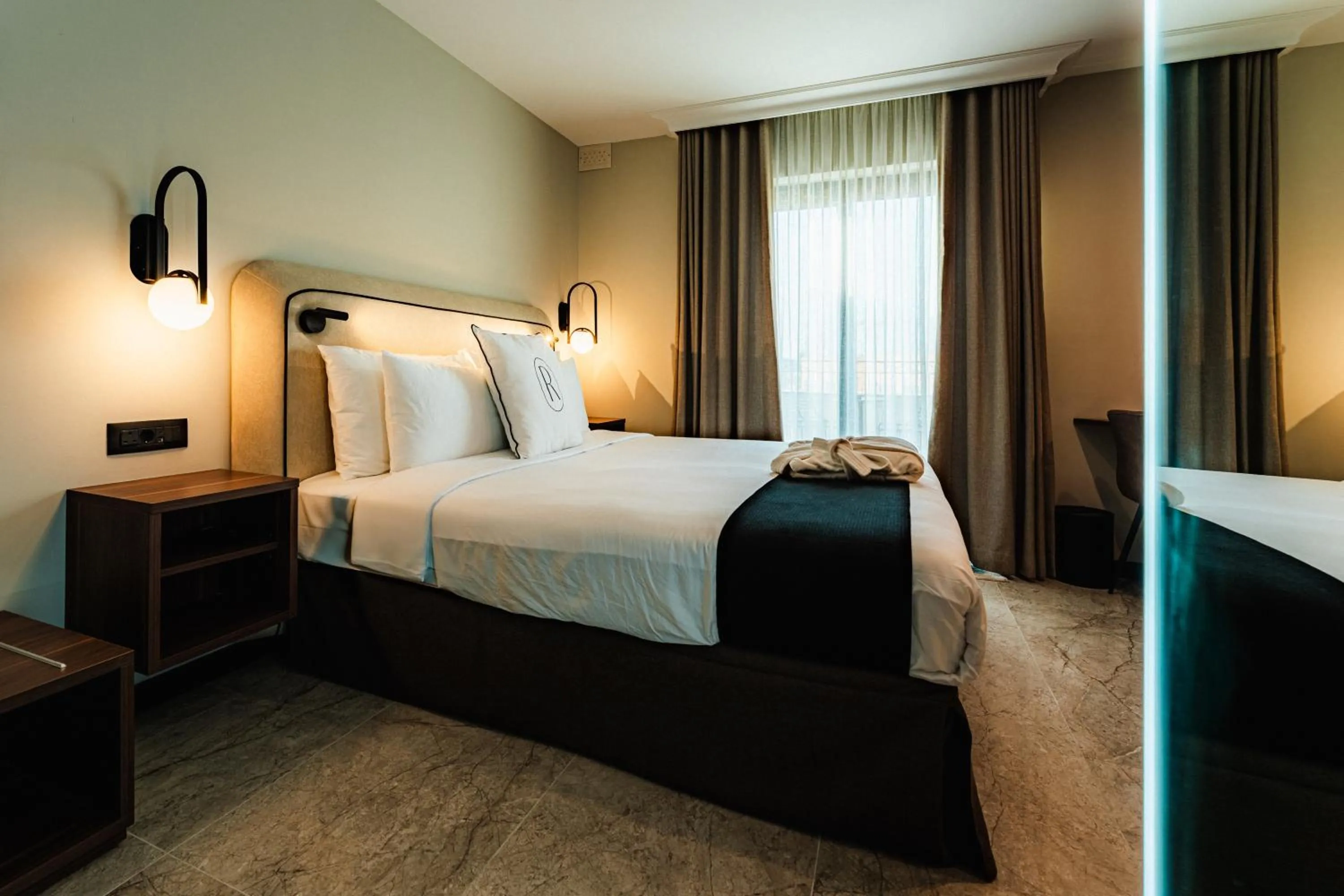 Bed in Royale Sainte Hélène Boutique Hotel