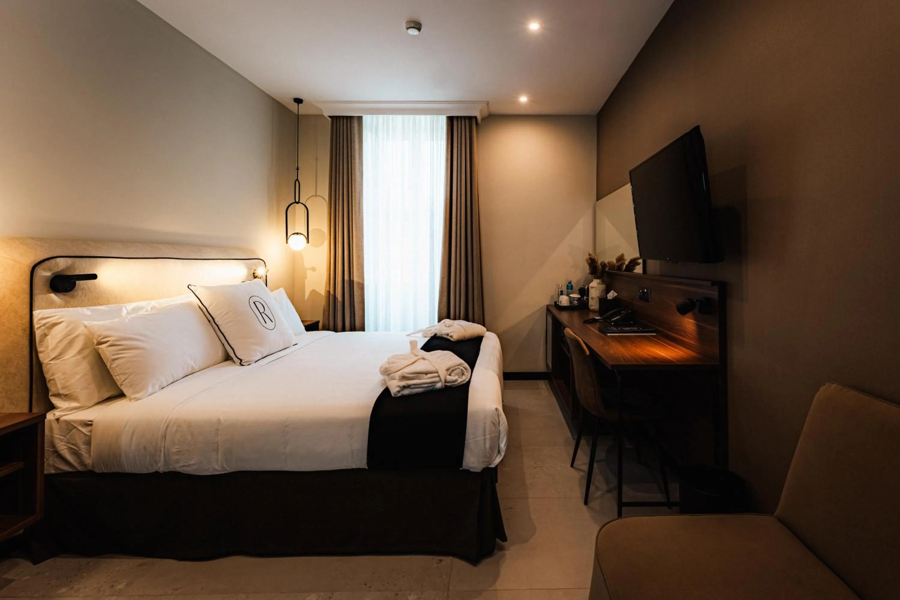 Bed in Royale Sainte Hélène Boutique Hotel