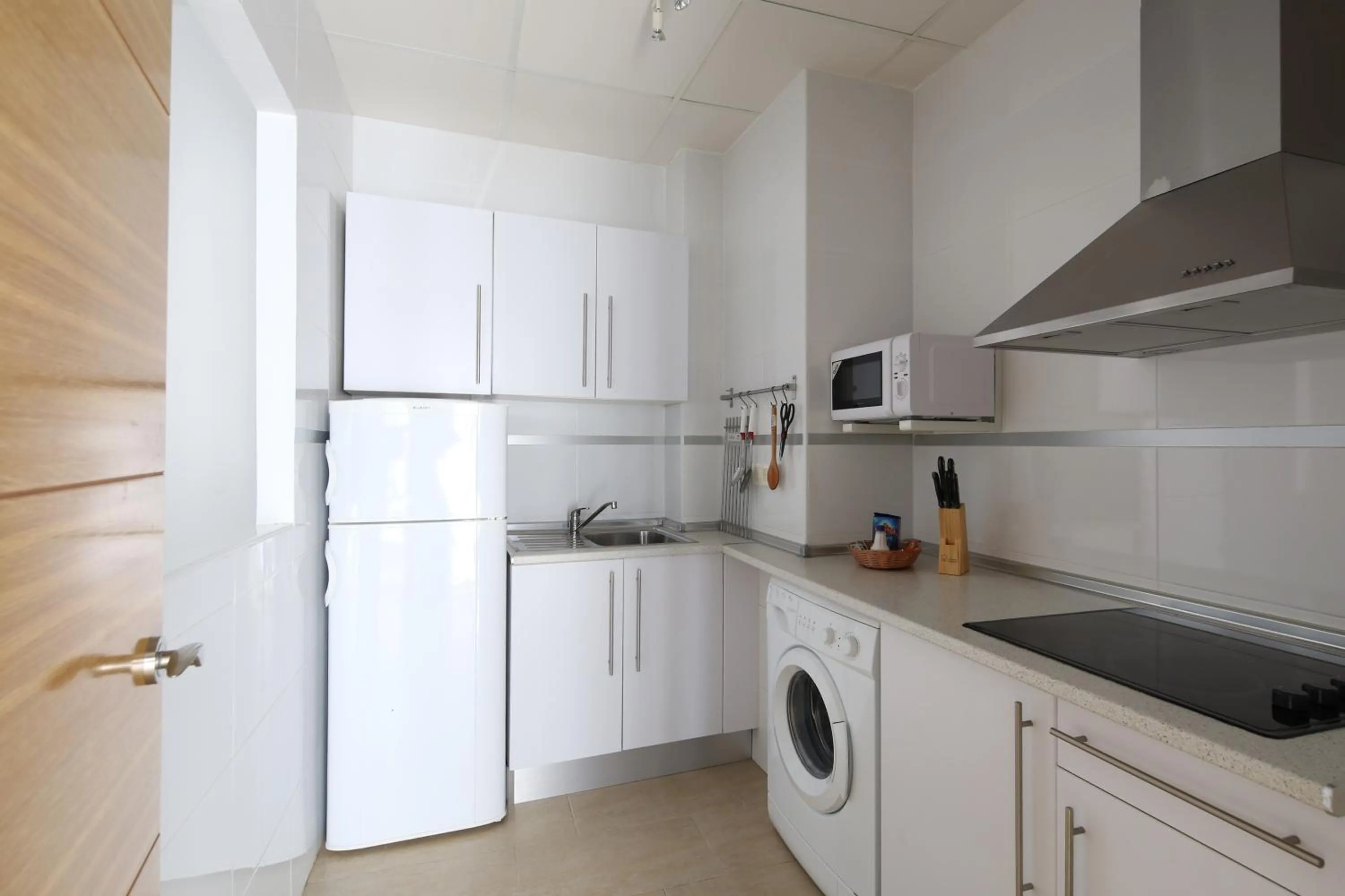 Kitchen or kitchenette in Apartamentos Diaber San Leandro