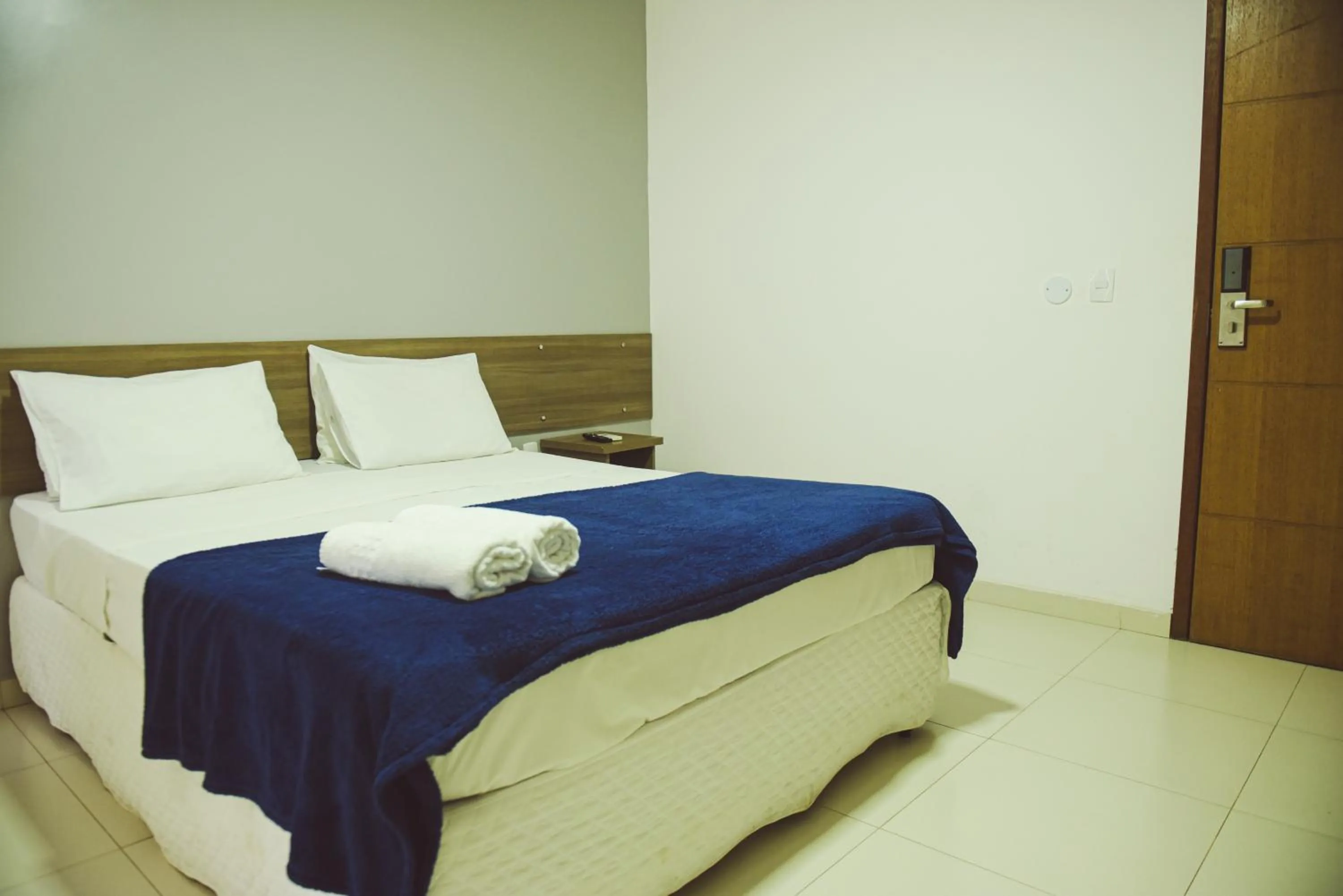 Bed in Pousada Xerxes