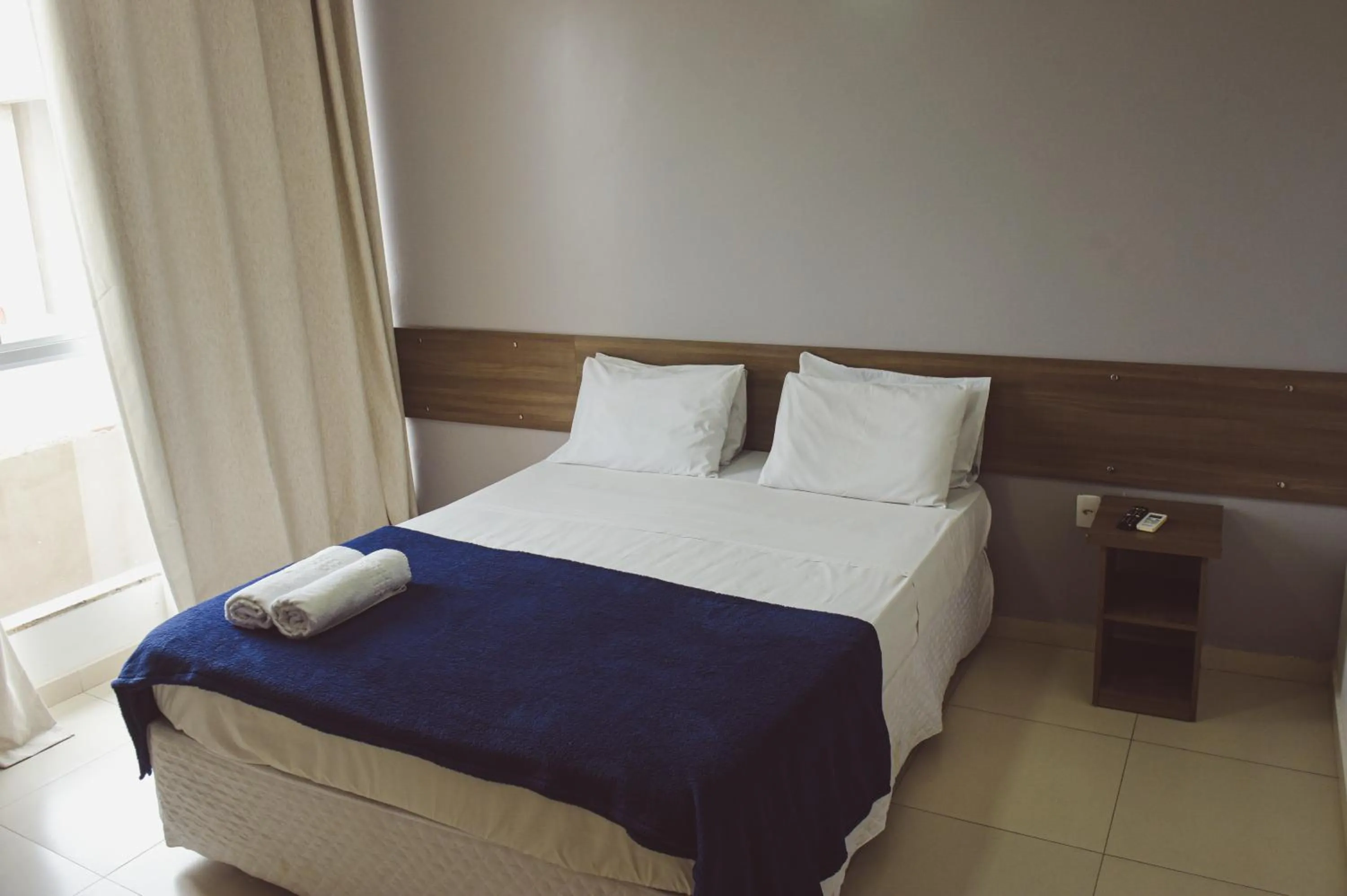 Bed in Pousada Xerxes