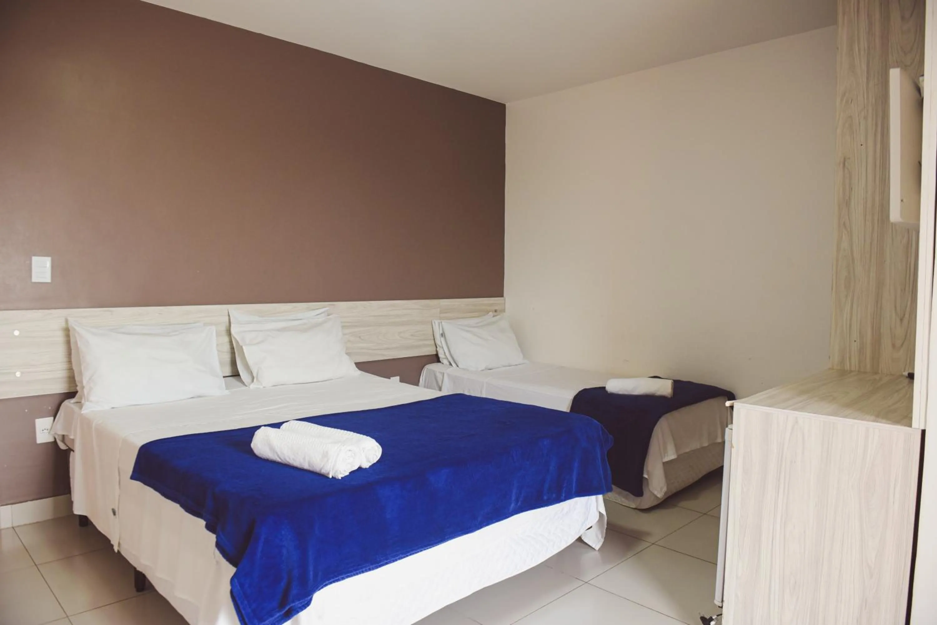 Bed in Pousada Xerxes