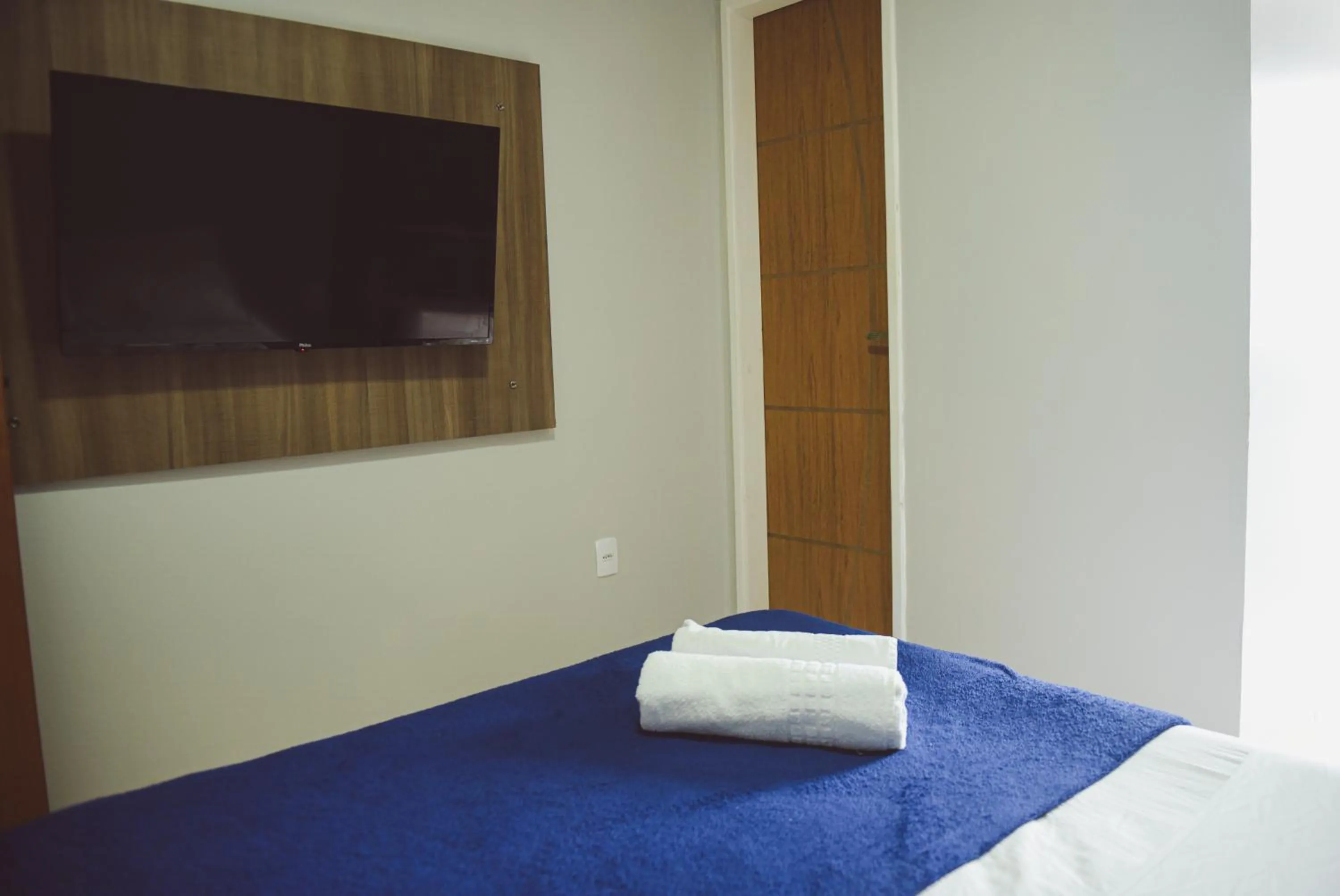 Bed in Pousada Xerxes