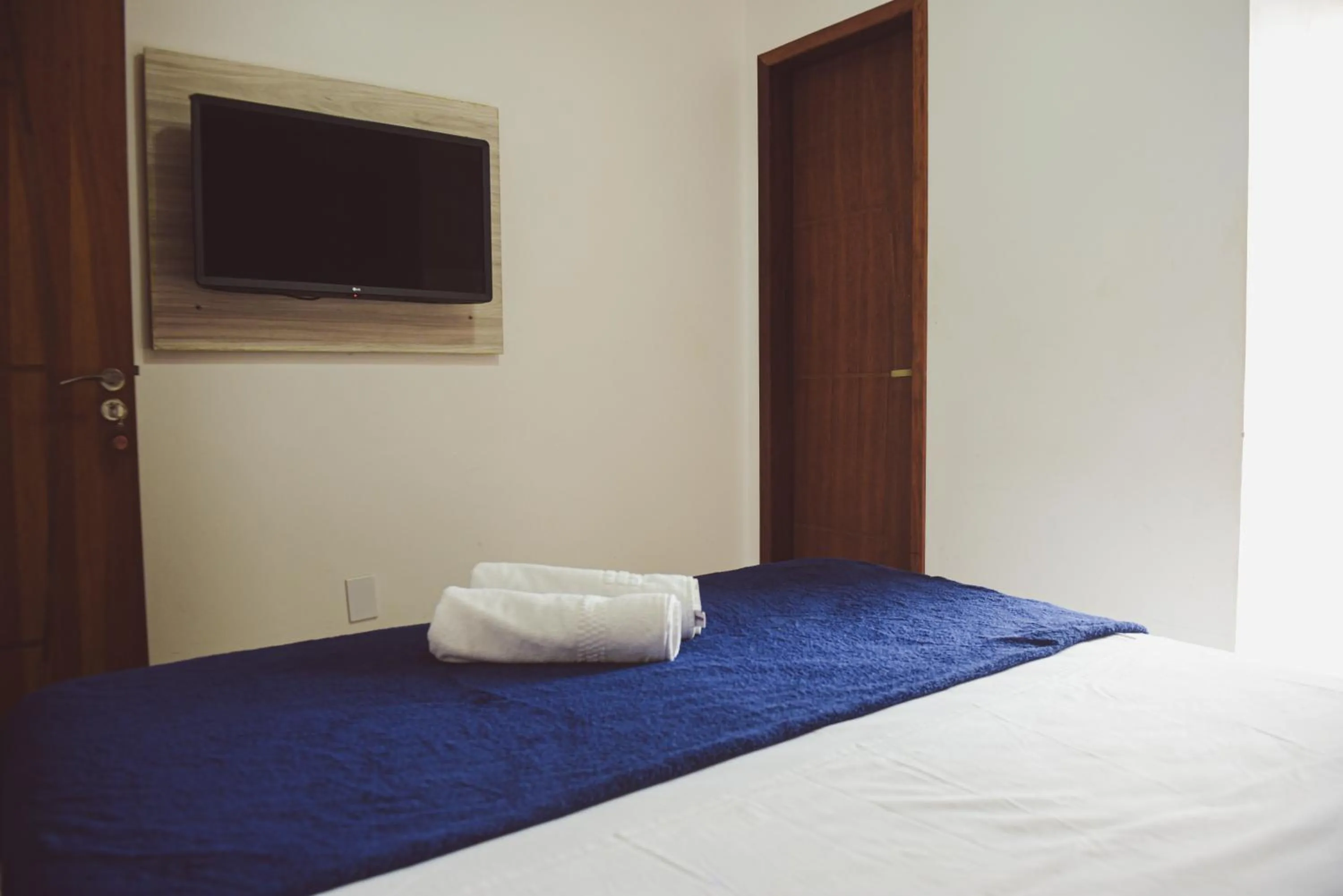 Bed in Pousada Xerxes